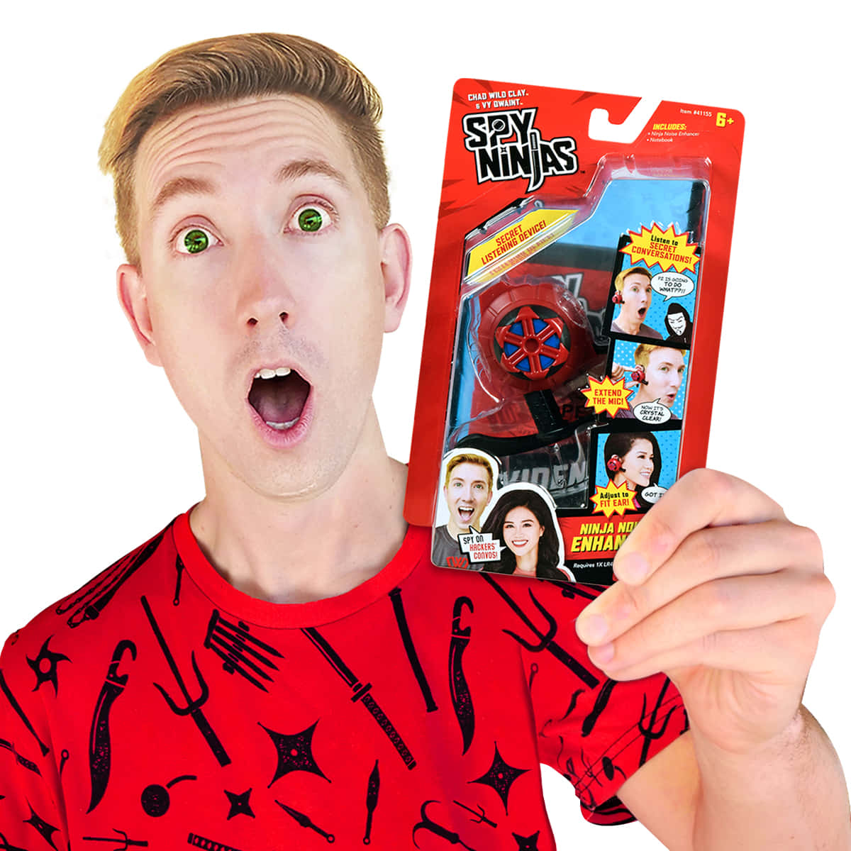 shocked face 桌布 壁紙 — 一名穿著紅色忍者主題襯衫的男子，以誇張的驚訝表情舉起一個 Spy Ninjas 玩具包裝。