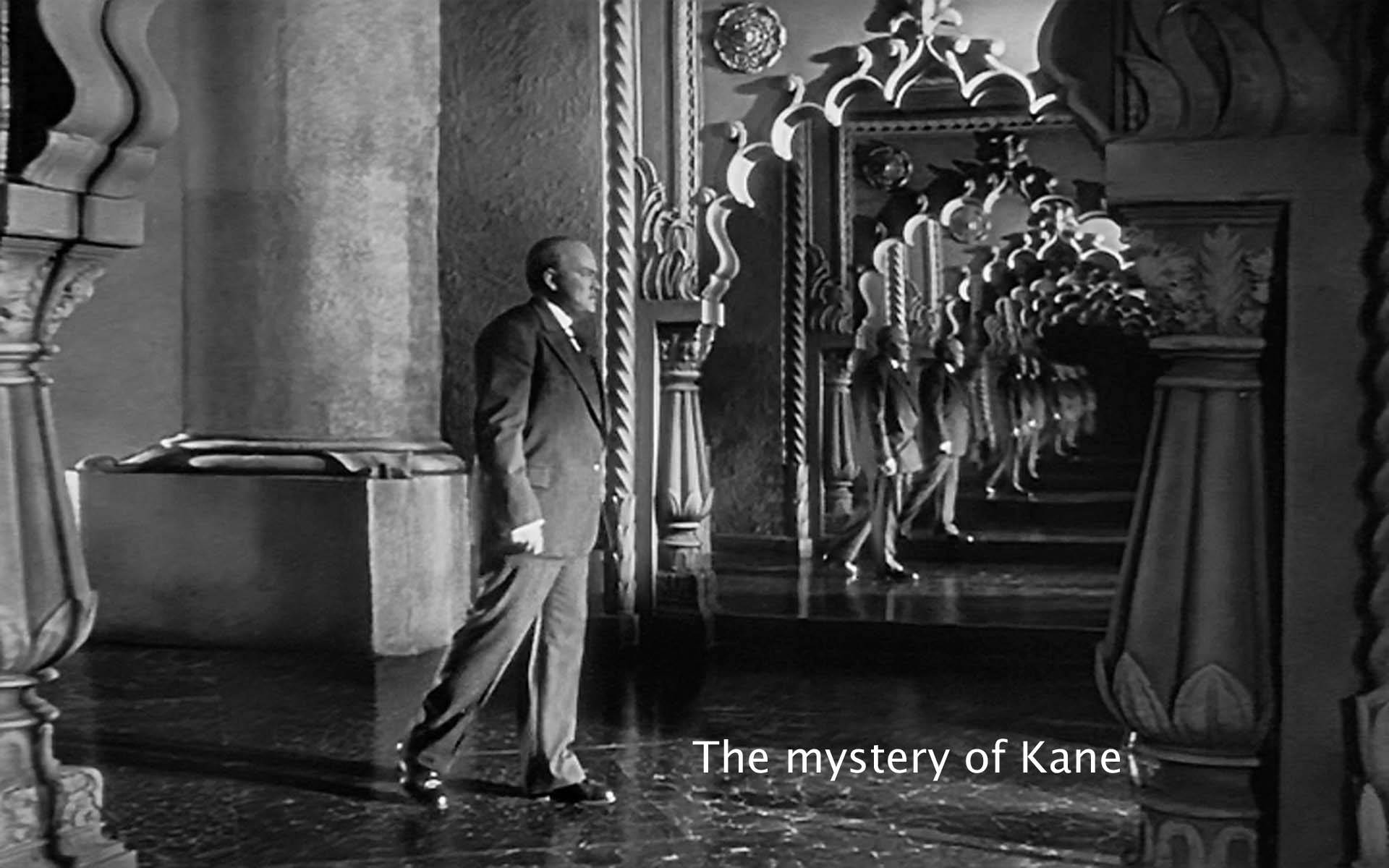 Citizen Kane 桌布 壁紙 — 一名穿著西裝的男子走過一條華麗的走廊，重複的鏡面反射營造出超現實的深度效果。
