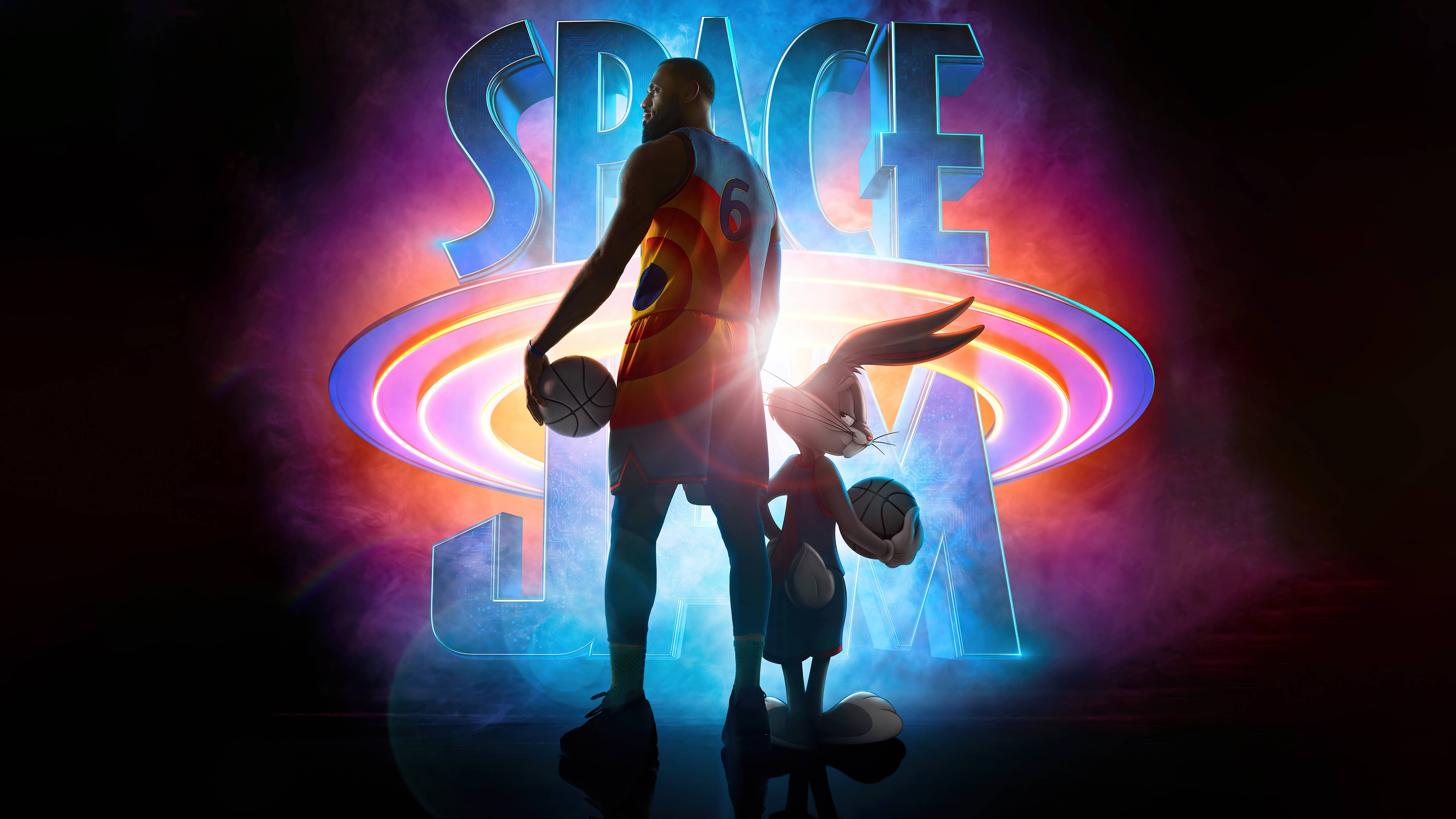 jam 桌布 壁紙 — 一名籃球運動員和兔子站在發光的「SPACE JAM」文字背光下，呈現充滿活力的宇宙色彩。