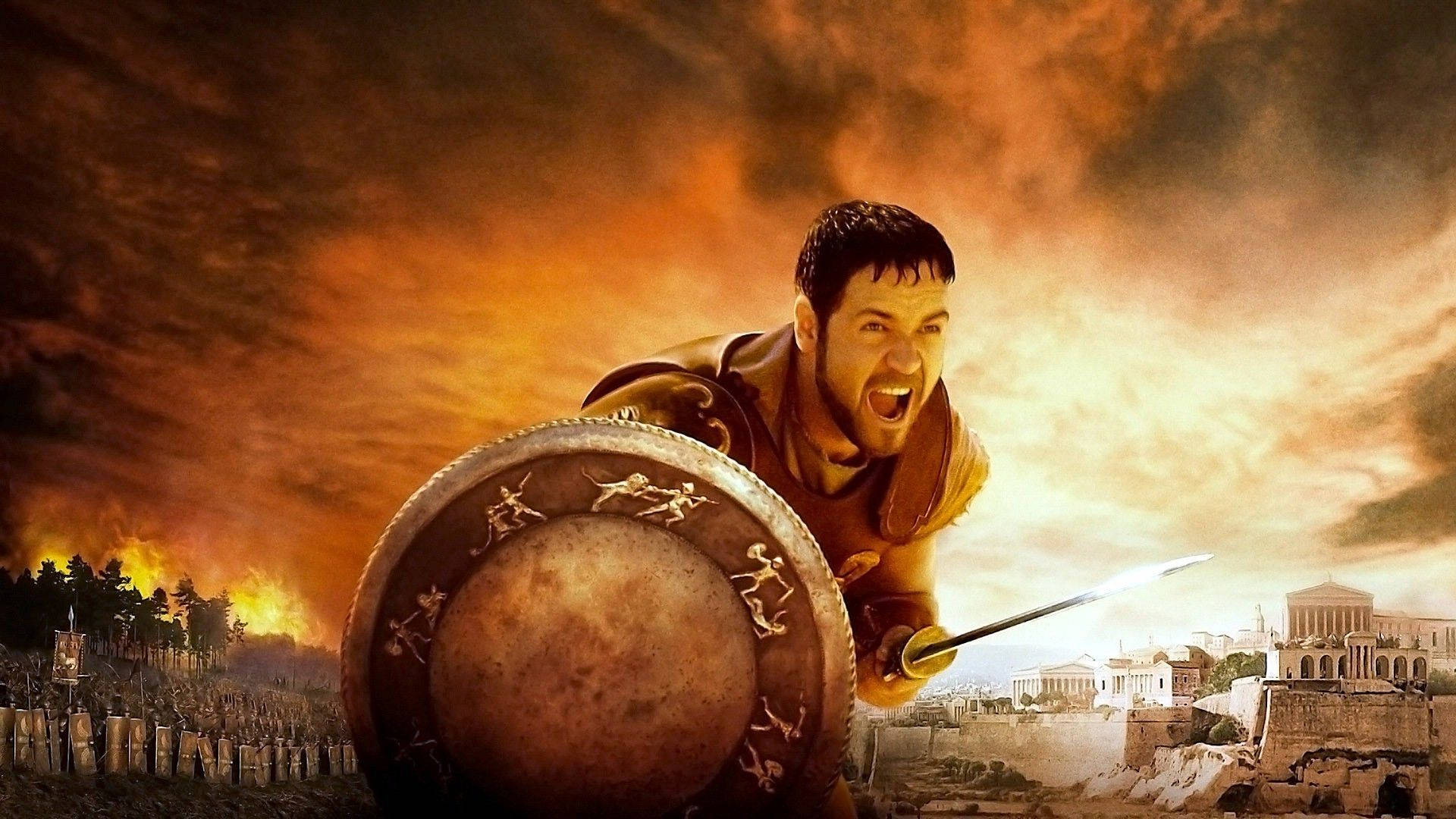 Gladiator 桌布 壁紙 — 一名羅馬士兵在古老戰場和廢墟上，對著熾熱的日落舉起劍和盾牌咆哮。