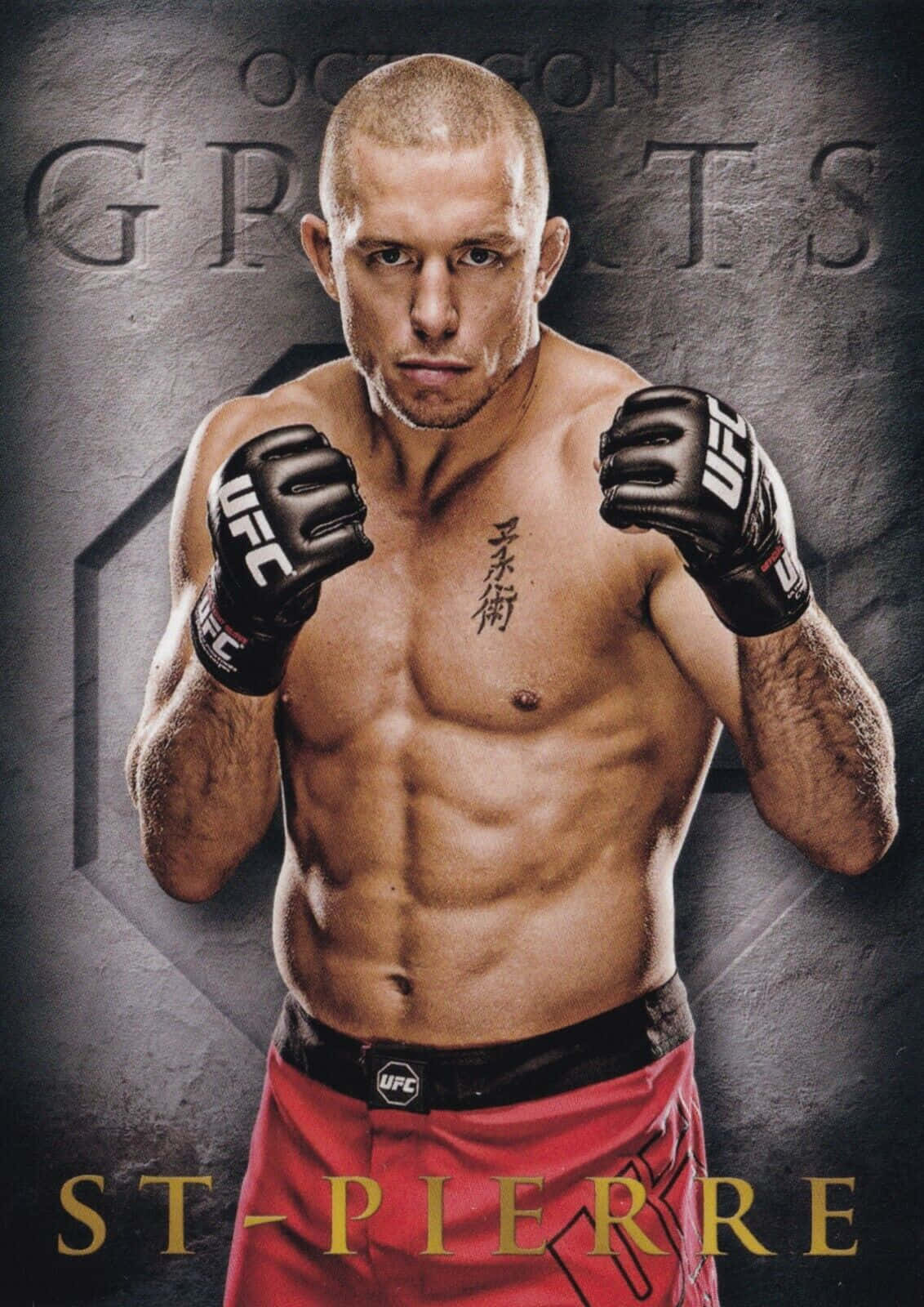 martial arts 桌布 壁紙 — 一名肌肉發達的UFC拳手穿著紅色短褲和黑色手套，在帶有 'UFC GREATEST' 和 'ST-PIERRE' 文字的深色紋理背景前凝視著。