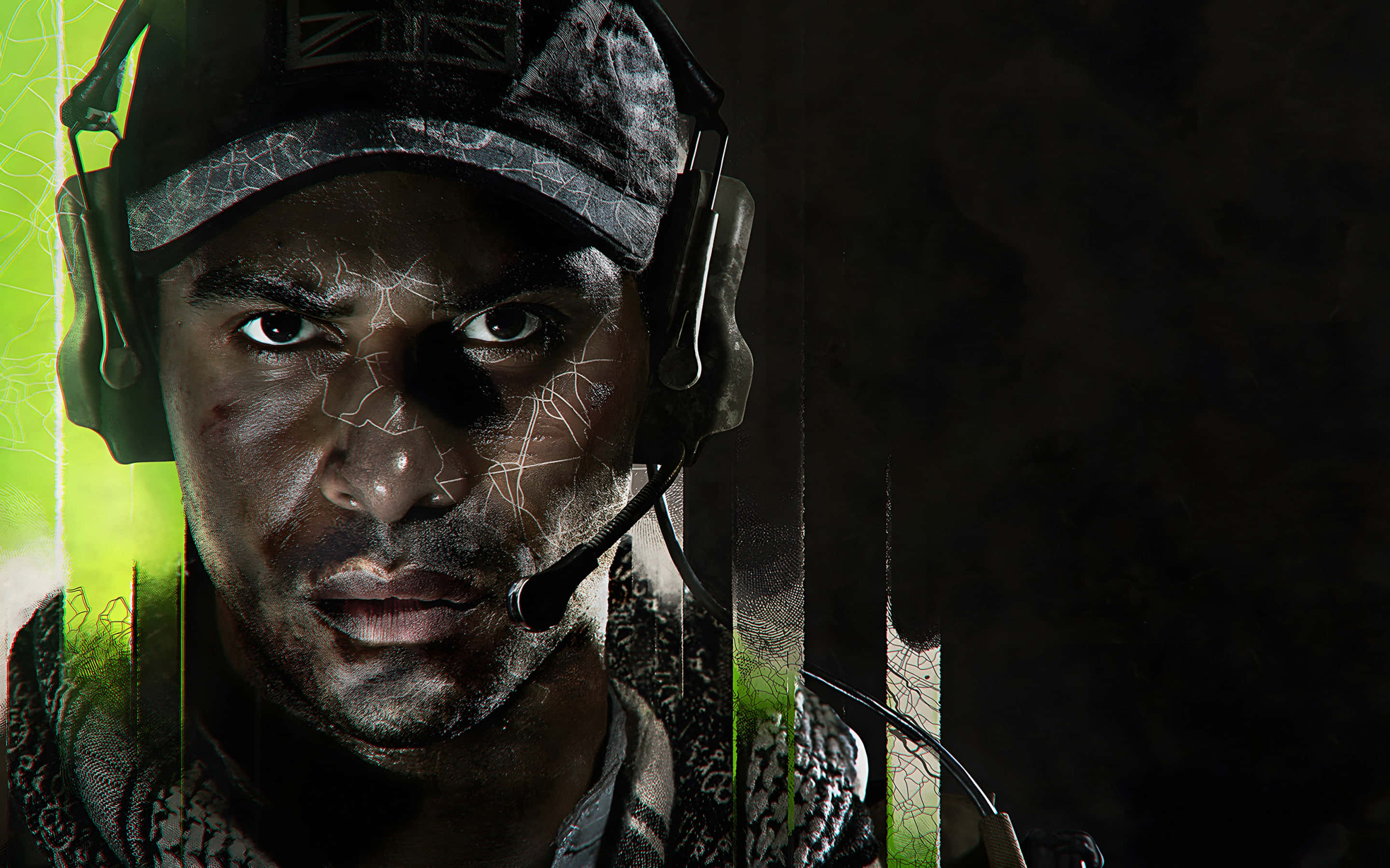 Call Of Duty Mw 桌布 壁紙 — 一名臉部破裂、戴著耳機的士兵，在黑暗背景中散發著綠色垂直光線，凝視著前方。