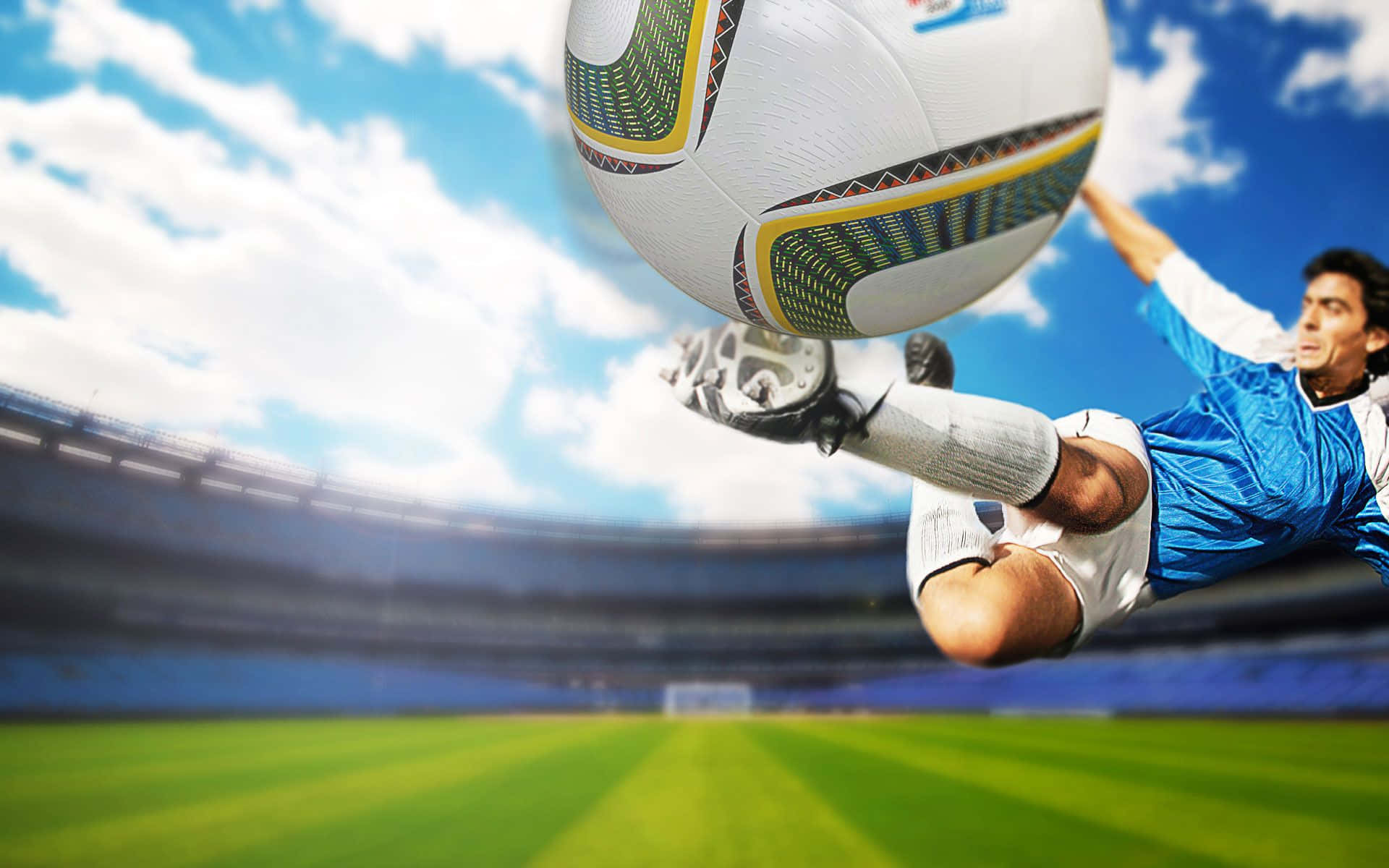 3d Sports 桌布 壁紙 — 一名足球運動員在藍天白雲下的活力球場中凌空踢球。