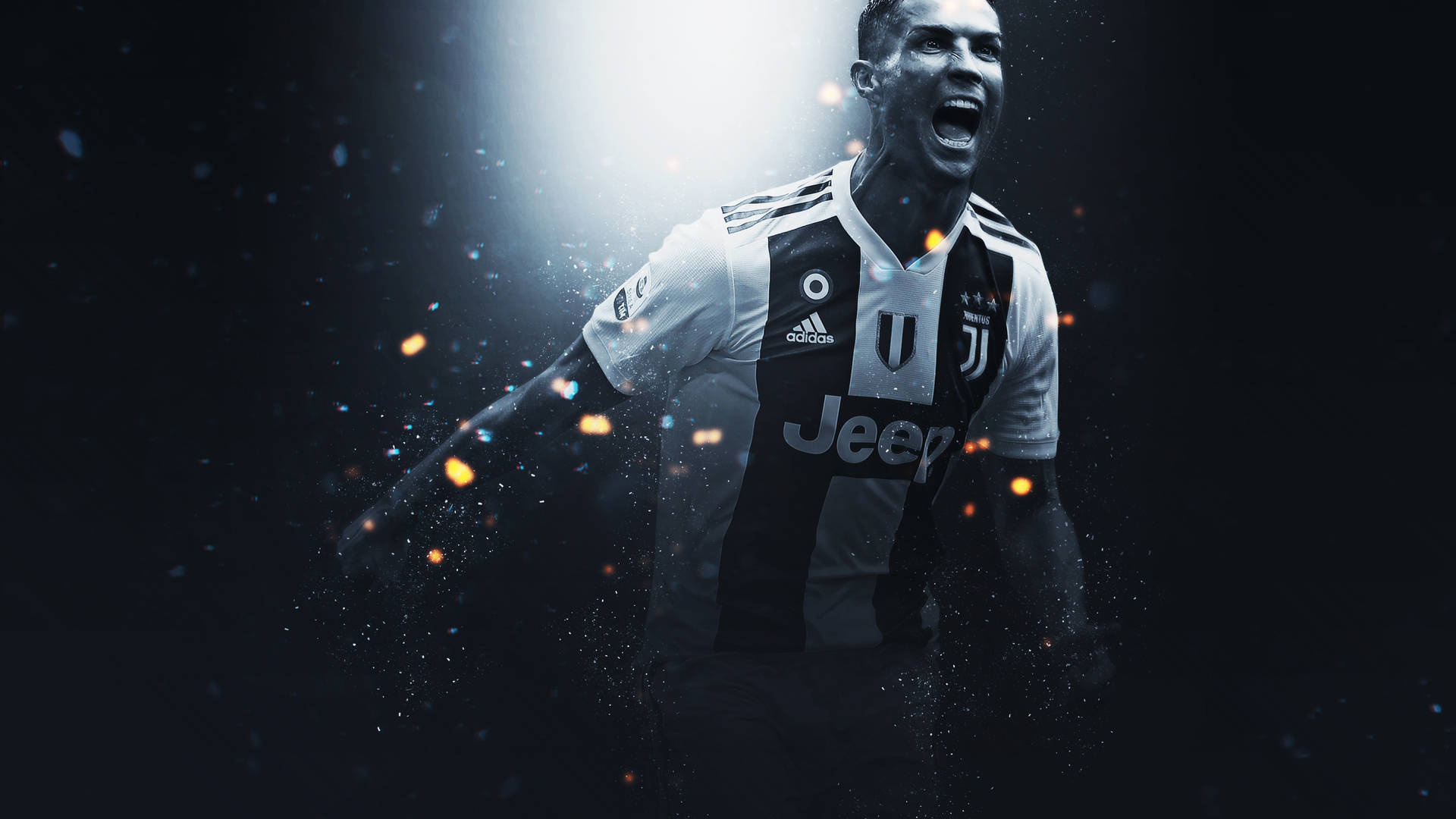 Ronaldo 桌布 壁紙 — 一名身穿尤文圖斯球衣的足球運動員在黑暗背景中，伴隨著發光粒子和戲劇性燈光，發出勝利的咆哮。