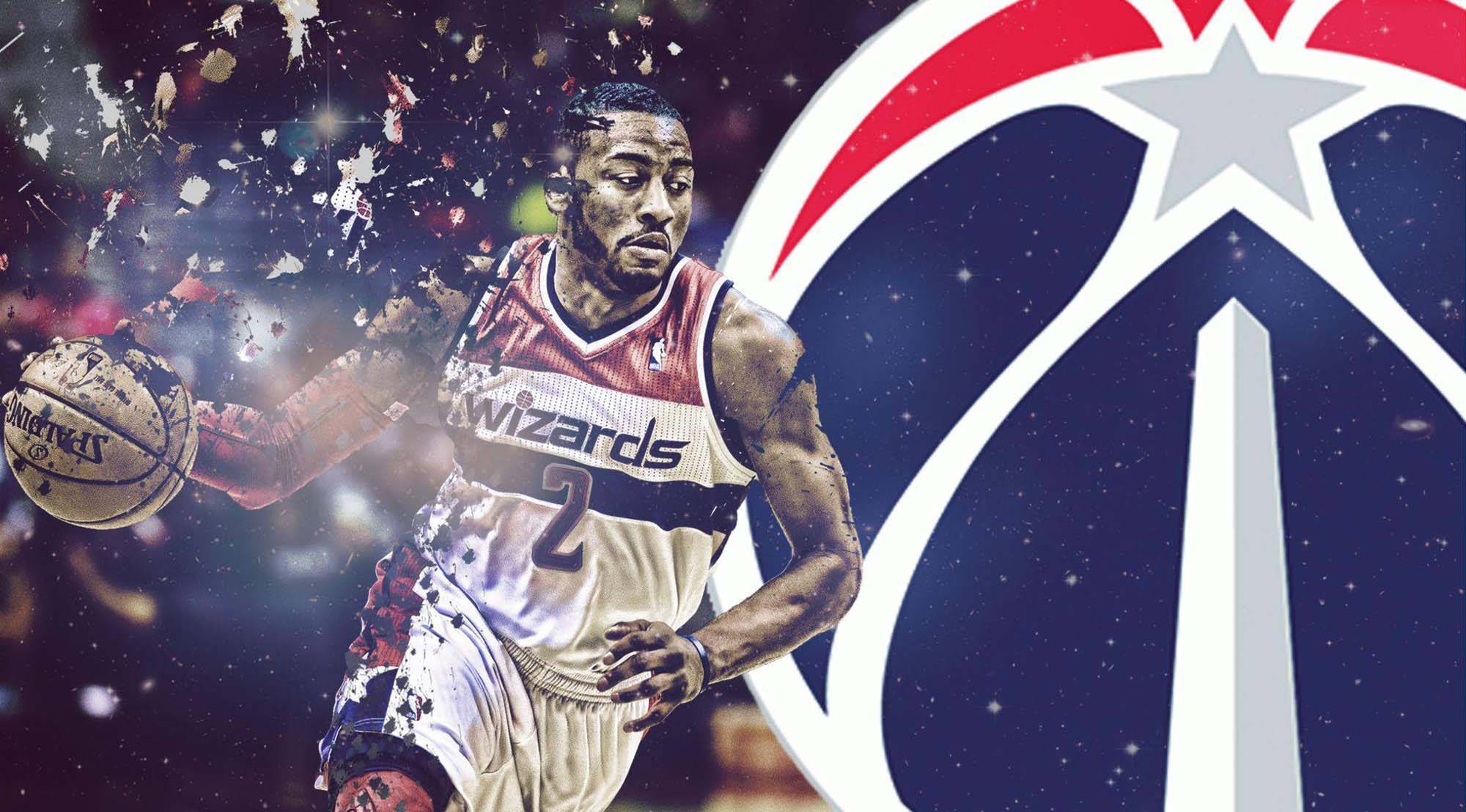 John Wall 桌布 壁紙 — 一名身穿巫師隊球衣的動感籃球運動員在滿天星斗的背景和球隊標誌下，於五彩紙屑中運球。