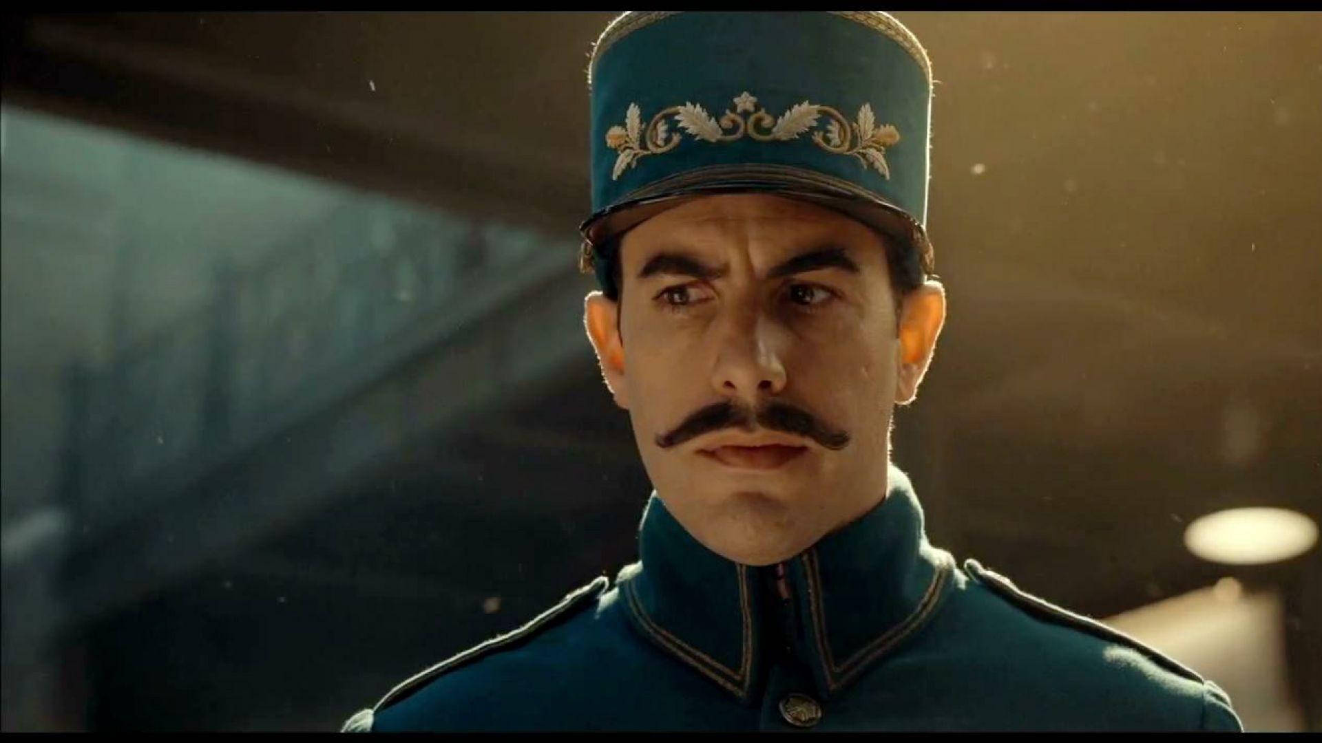 穿著軍裝、留鬍子、戴帽子的男人表情嚴肅 — King Von 壁紙