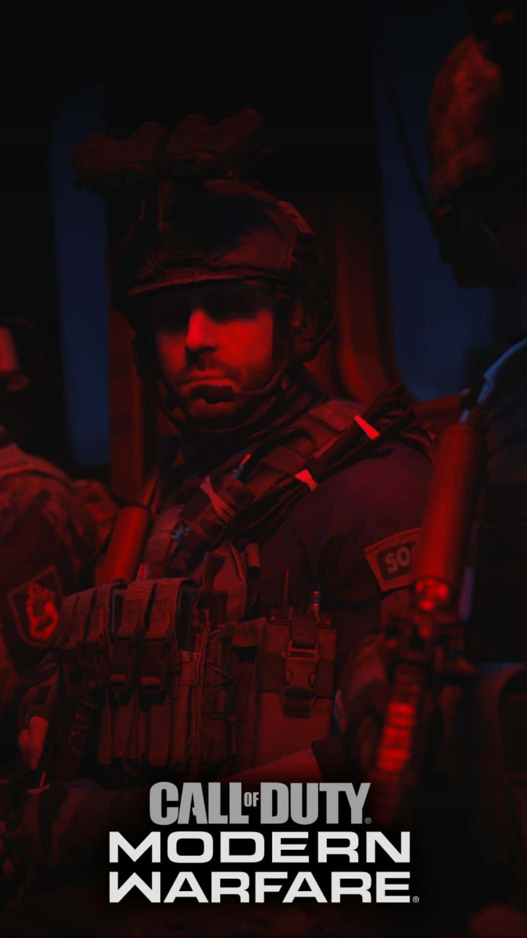 Android Call Of Duty Modern Warfare 桌布 壁紙 — 一名身穿戰術裝備的士兵在紅色燈光下，帶有「Call of Duty Modern Warfare」文字。