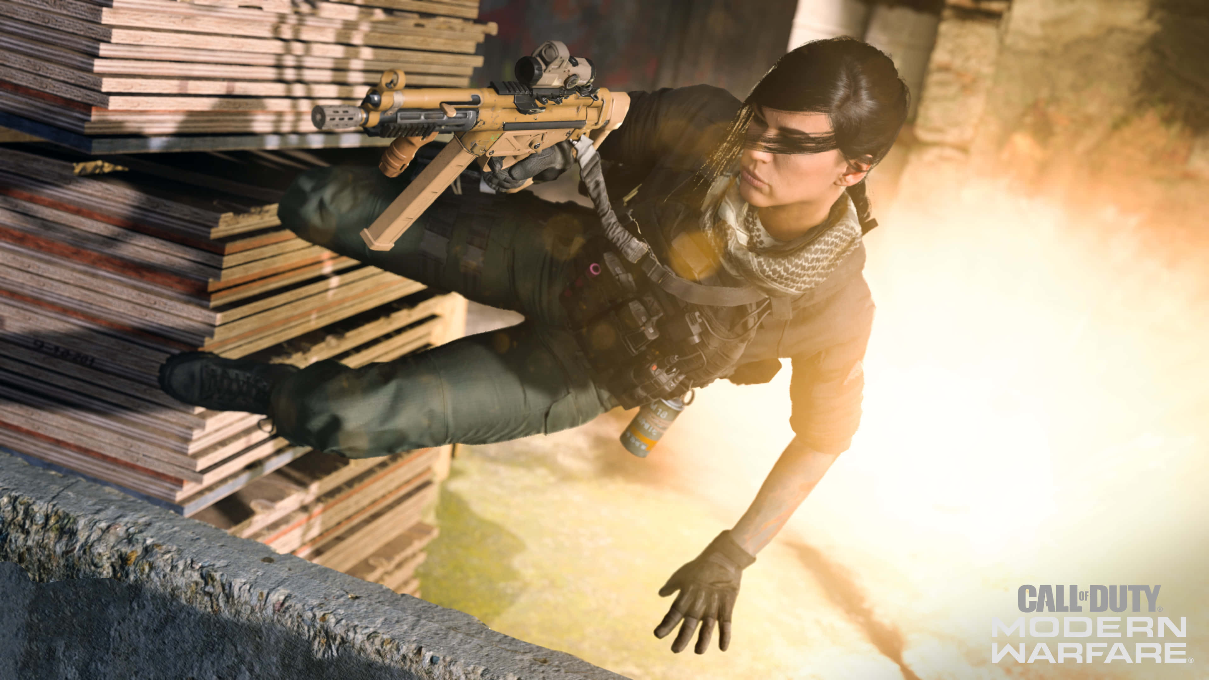 HD Call Of Duty Modern Warfare 桌布 壁紙 — 一名身穿戰術裝備的士兵手持步槍，在堆疊的木棧板上方凌空躍起，明亮的槍口閃光照亮了場景。