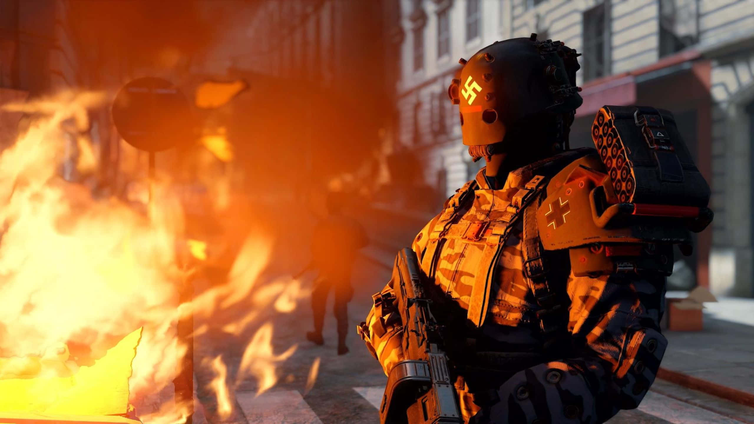 Wolfenstein Ii 桌布 壁紙 — 一名身穿戰術裝備的士兵站在燃燒的城市混亂中，背景是燃燒的建築物和煙霧。