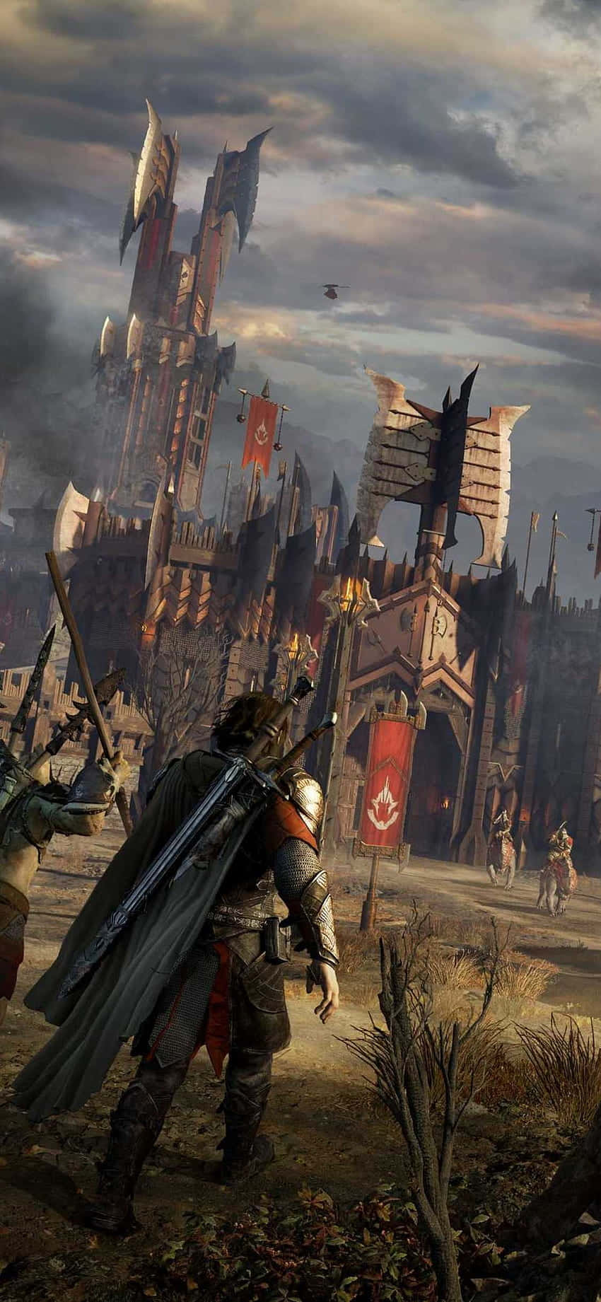 Shadow Of Mordor 桌布 壁紙 — 一名身穿暗色盔甲的戰士站在高聳的哥德式城堡前，背景是暴風雨的黃昏天空，旗幟飄揚。