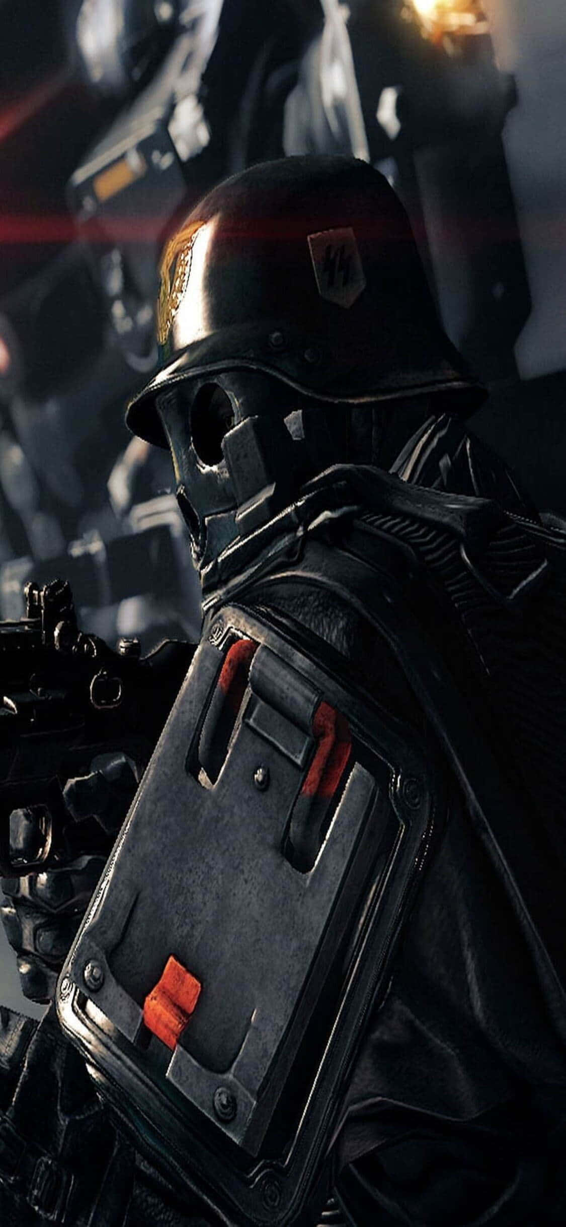 iPhone Xs Wolfenstein Ii 桌布 壁紙 — 一名身穿深色戰術裝備和頭盔、帶有紅色點綴的士兵，站在燈光昏暗的未來戰鬥區域。