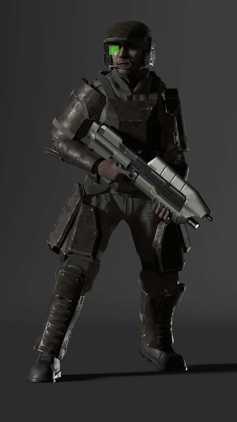 Halo Unsc 桌布 壁紙 — 一名身穿深色未來盔甲的士兵，在純灰色背景前手持重型武器。