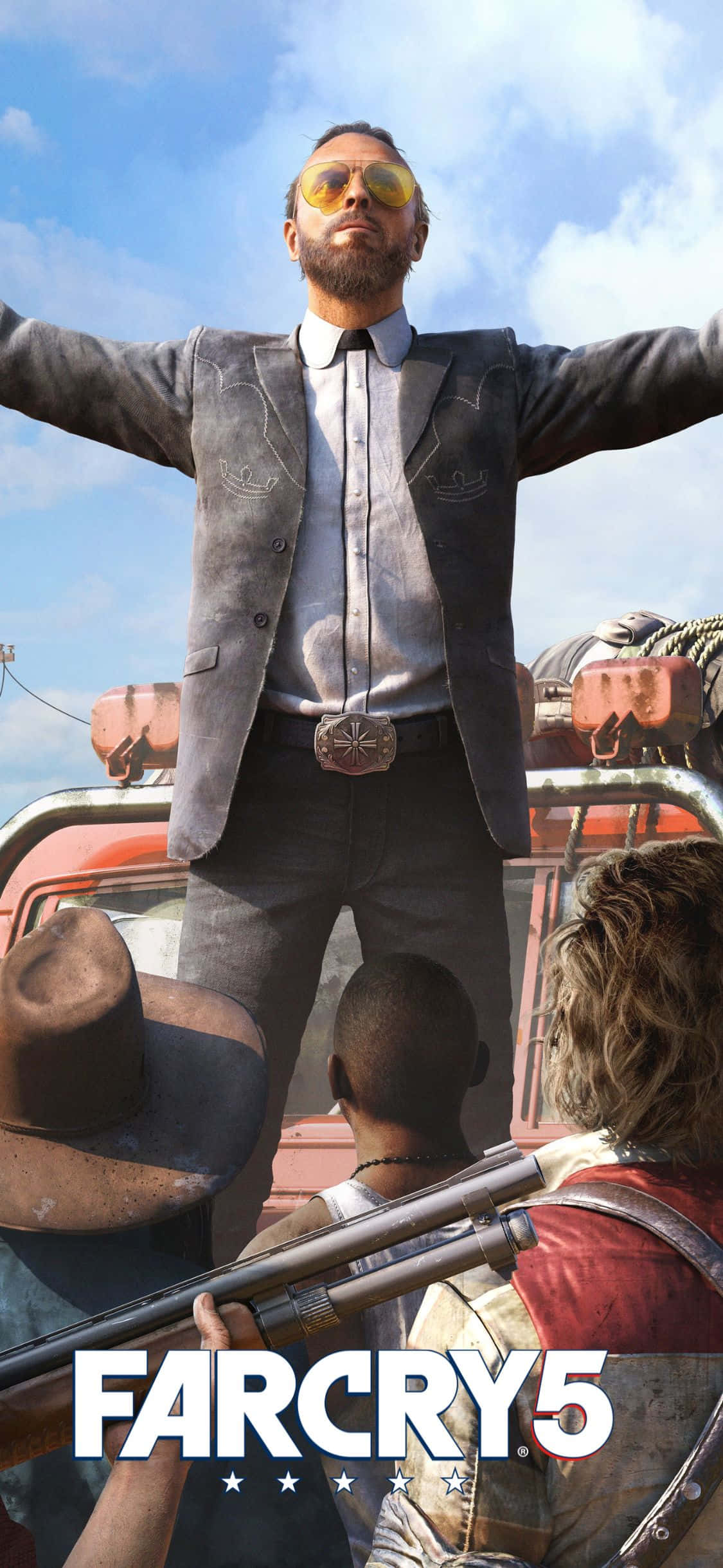 iPhone Xs Far Cry 5 桌布 壁紙 — 一名身穿灰色西裝和黃色太陽眼鏡的男子，在藍天白雲下，張開雙臂站在一輛紅色車輛上。