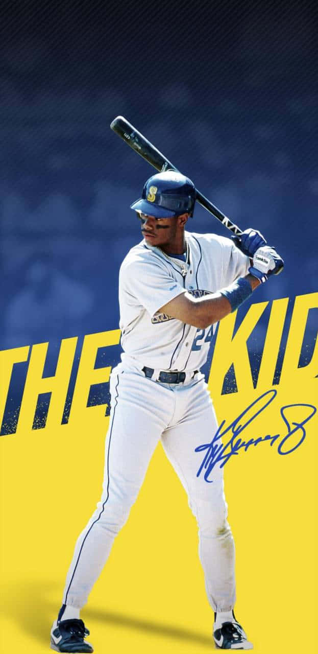 MLB 桌布 壁紙 — 一名身穿白色制服和藍色帽子的棒球運動員，準備在鮮黃色和深藍色背景上揮棒，背景上有「THE KID」文字和簽名。