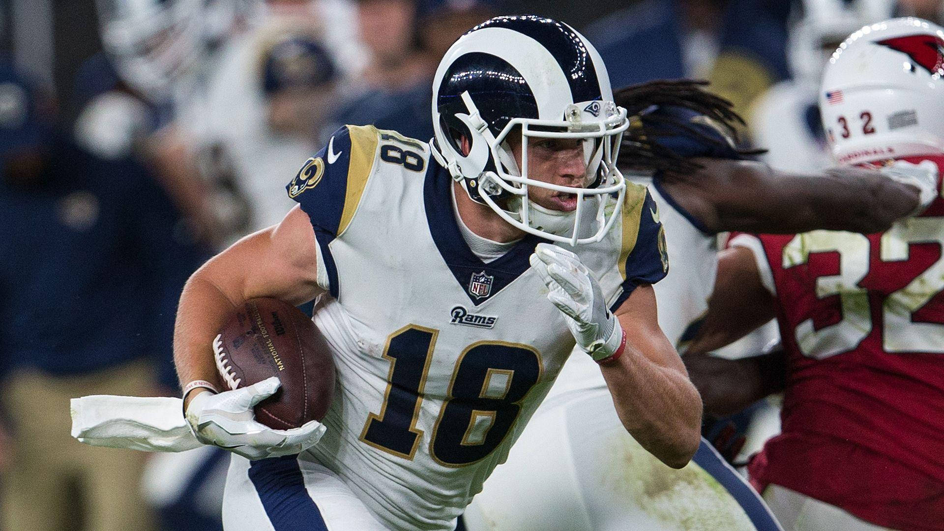 比賽中帶球奔跑的美式足球員 — NFL GIF 壁紙