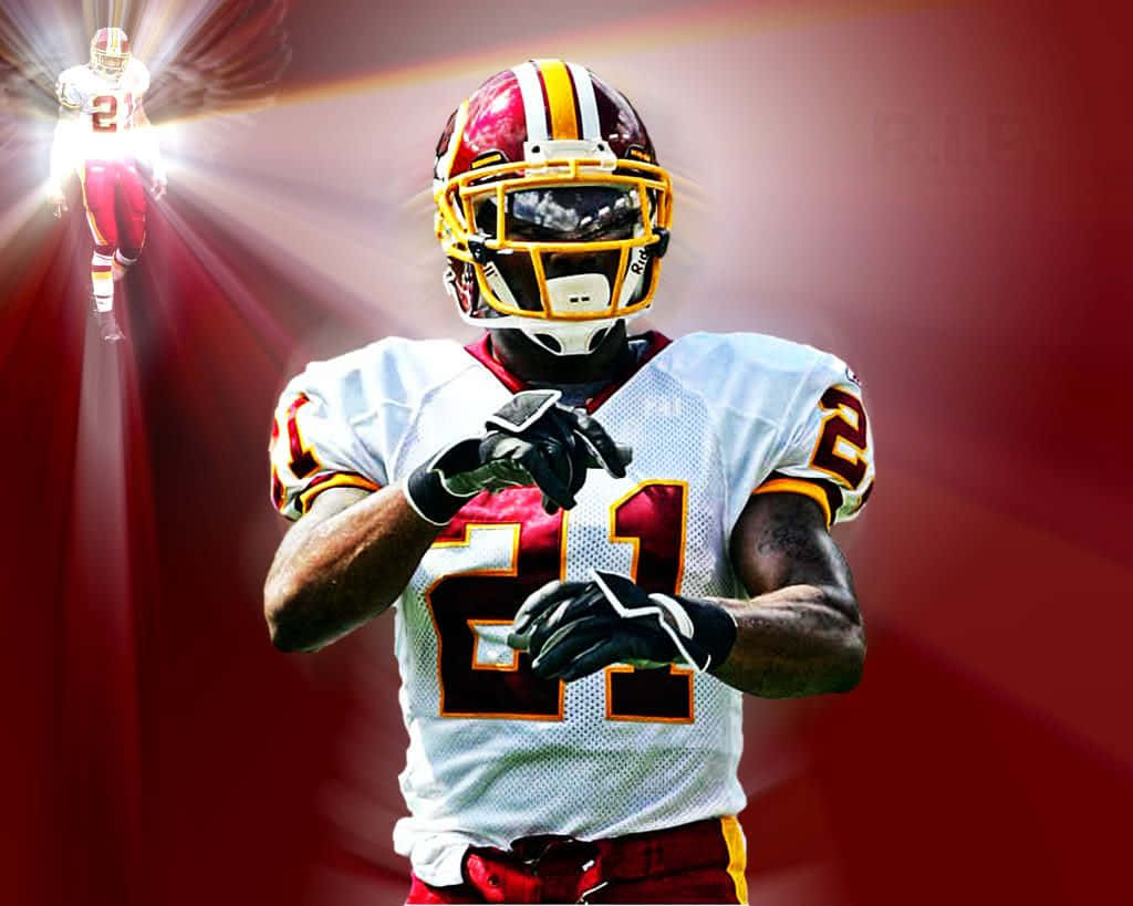 Washington Redskins 桌布 壁紙 — 一名身穿白色球衣、號碼21的足球運動員自信地站在耀眼的紅色背景前，身後有一個發光的雙重身影。