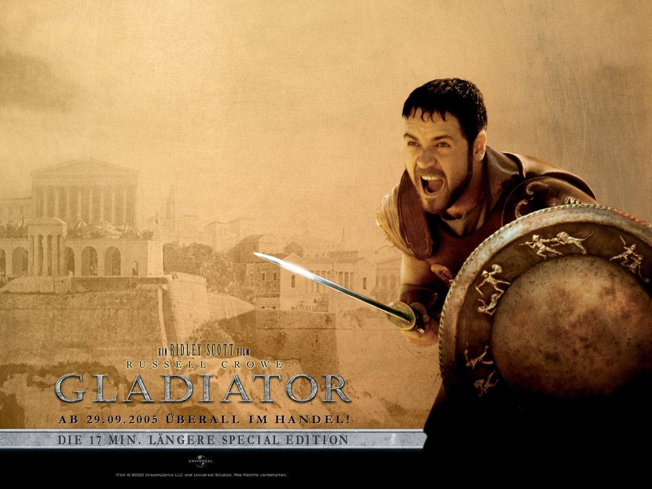 Gladiator 桌布 壁紙 — 一名身穿盔甲、咆哮的角鬥士，在塵土飛揚的羅馬競技場背景下緊握劍和盾牌。