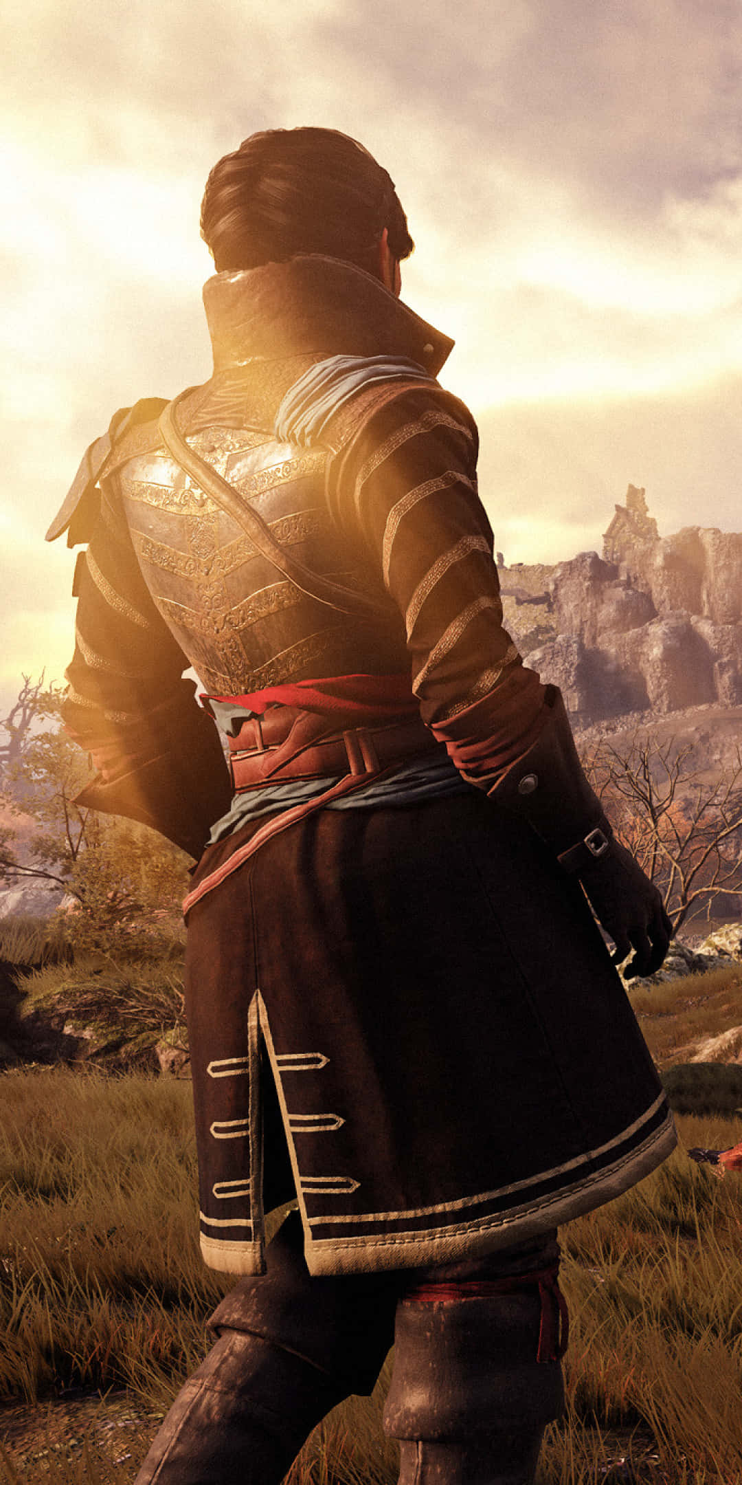 Pixel 3 Greedfall 桌布 壁紙 — 一名身穿精細盔甲的戰士背對金色夕陽，俯瞰崎嶇的岩石地形。
