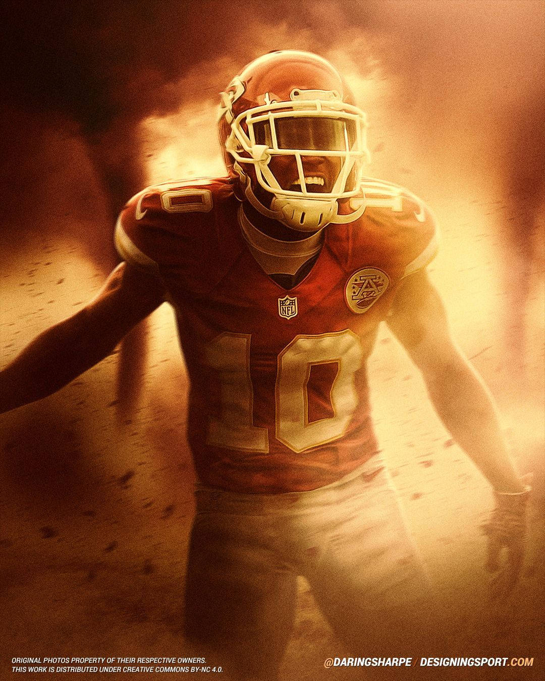 Tyreek Hill 桌布 壁紙 — 一名身穿紅色10號球衣的足球員，帶著強烈的決心衝過金色塵埃。