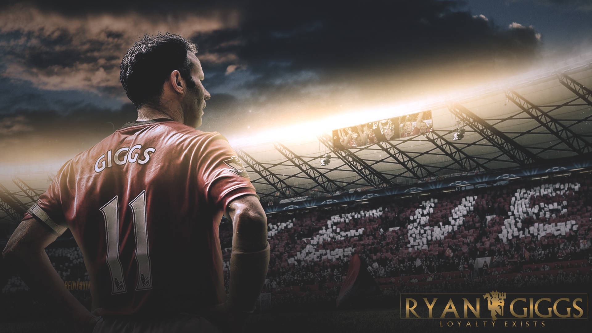 Ryan Giggs 桌布 壁紙 — 一名身穿紅色球衣、印有名字和11號的足球員背向觀眾，在戲劇性的日落燈光下站在球場上。