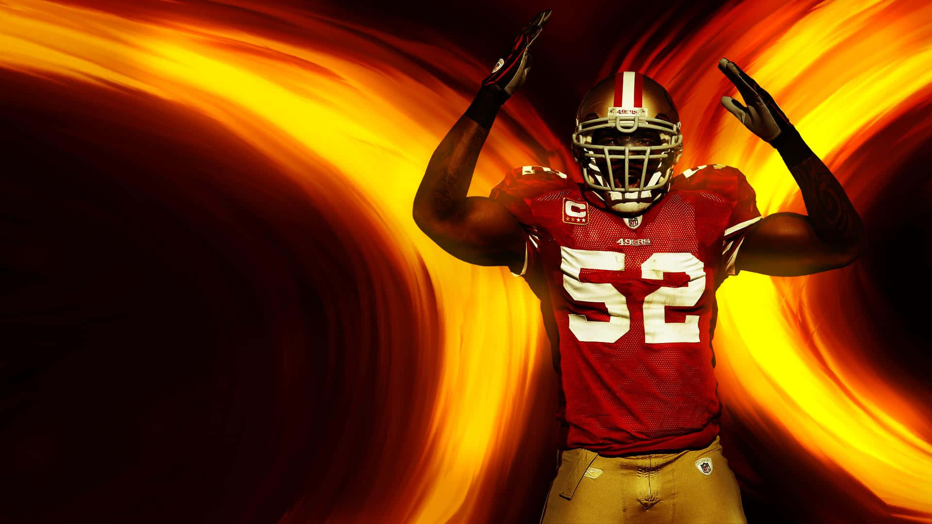 49ers 桌布 壁紙 — 一名身穿紅色球衣52號的美式足球運動員，在旋轉的熾熱橙色和黃色背景前勝利地站立。