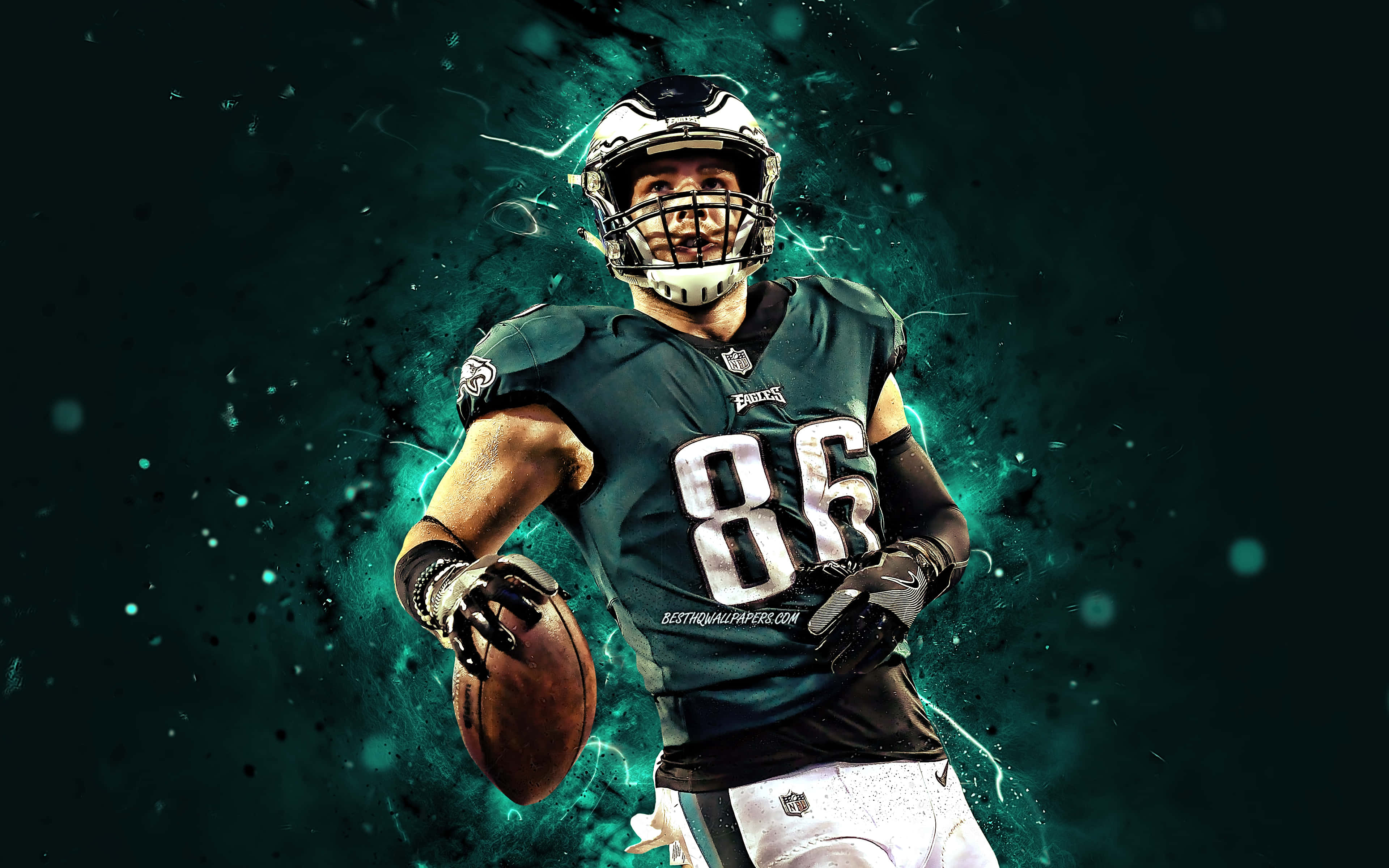 Eagles Football 桌布 壁紙 — 一名身穿綠色球衣、號碼86的美式足球員，在深藍綠色能量爆發背景下持球向前奔跑。