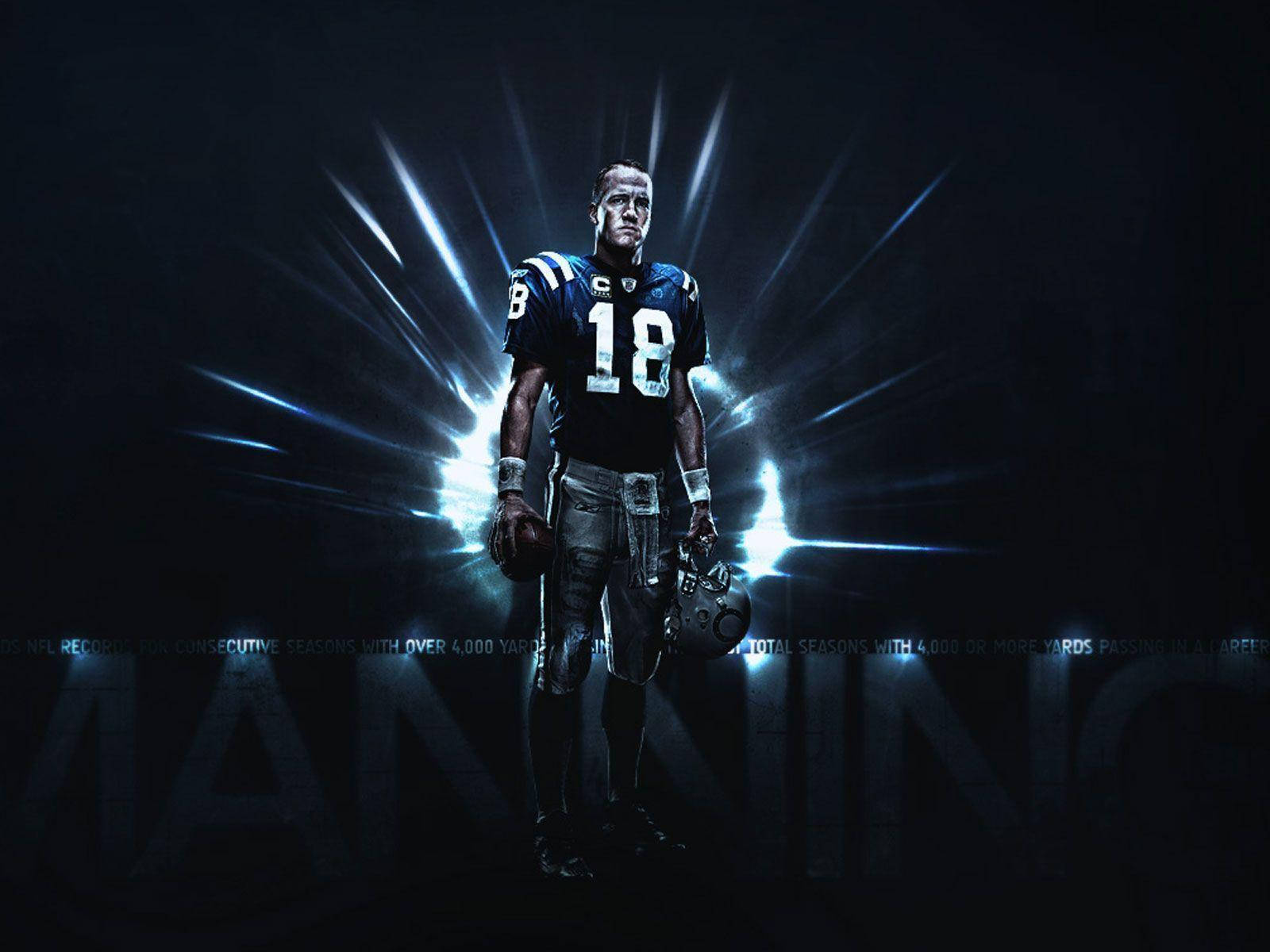 NFL 美式足球 桌布 壁紙 — 一名身穿藍色球衣、號碼18的足球運動員，在黑暗背景中，被明亮的藍色光線照亮。