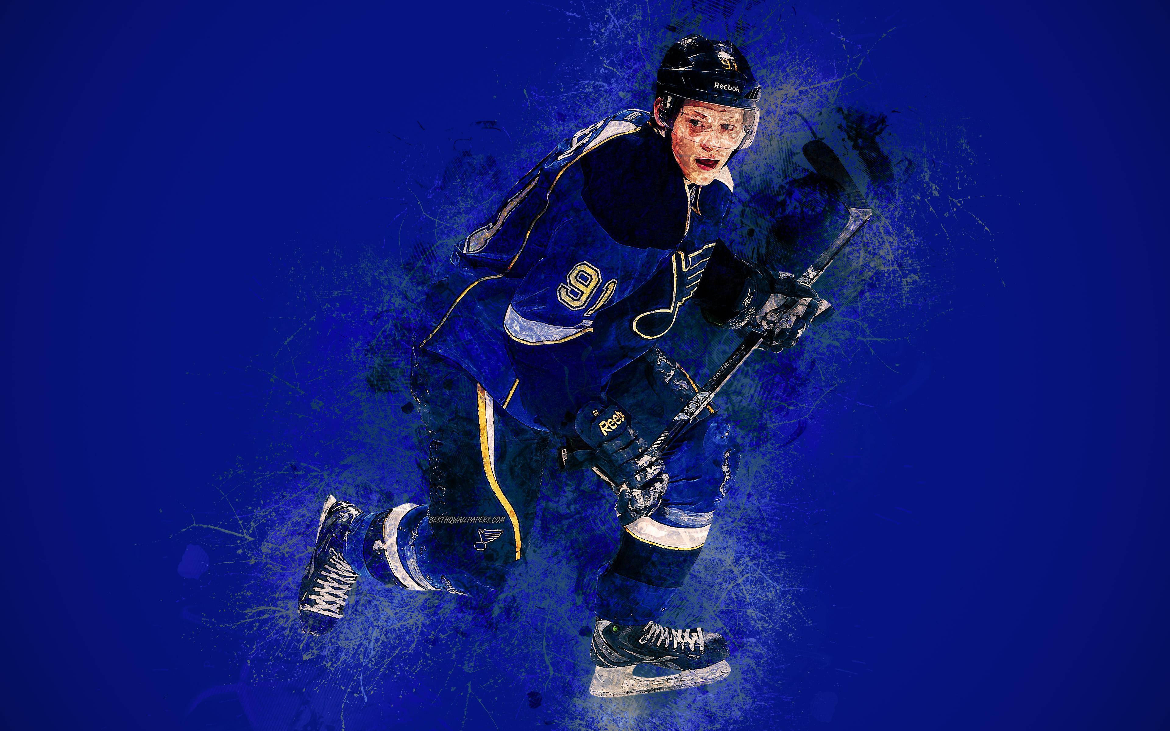 St Louis Blues 桌布 壁紙 — 一名身穿藍色球衣、號碼9的冰球運動員在充滿活力的藍色潑濺背景上動態滑冰。