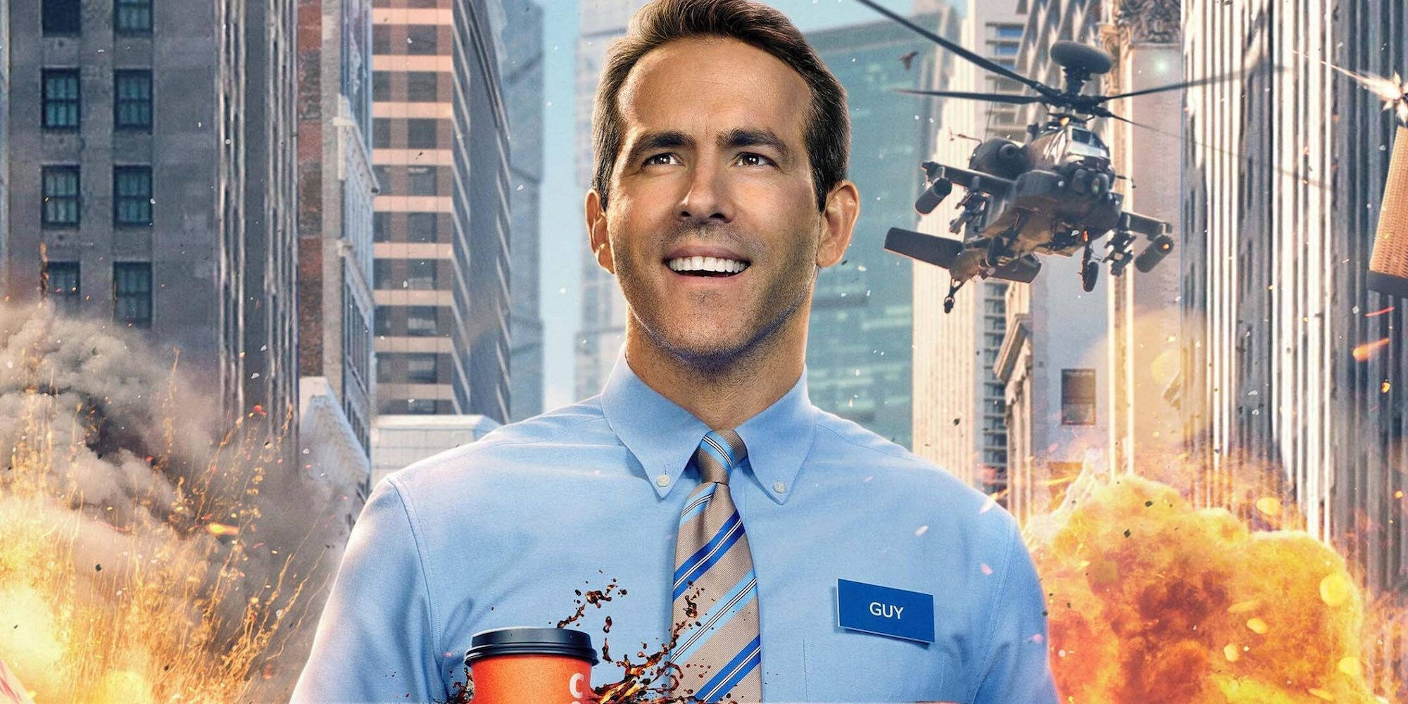 Reynolds 桌布 壁紙 — 一名身穿藍色襯衫的男子冷靜地微笑，身後的城市景觀中爆炸和直升機飛過。