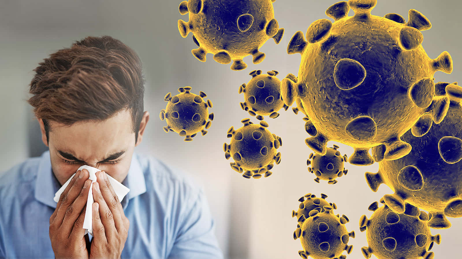 Coronavirus 桌布 壁紙 — 一名身穿藍色襯衫的男子對著衛生紙打噴嚏，發光的黃色病毒顆粒漂浮在他周圍。