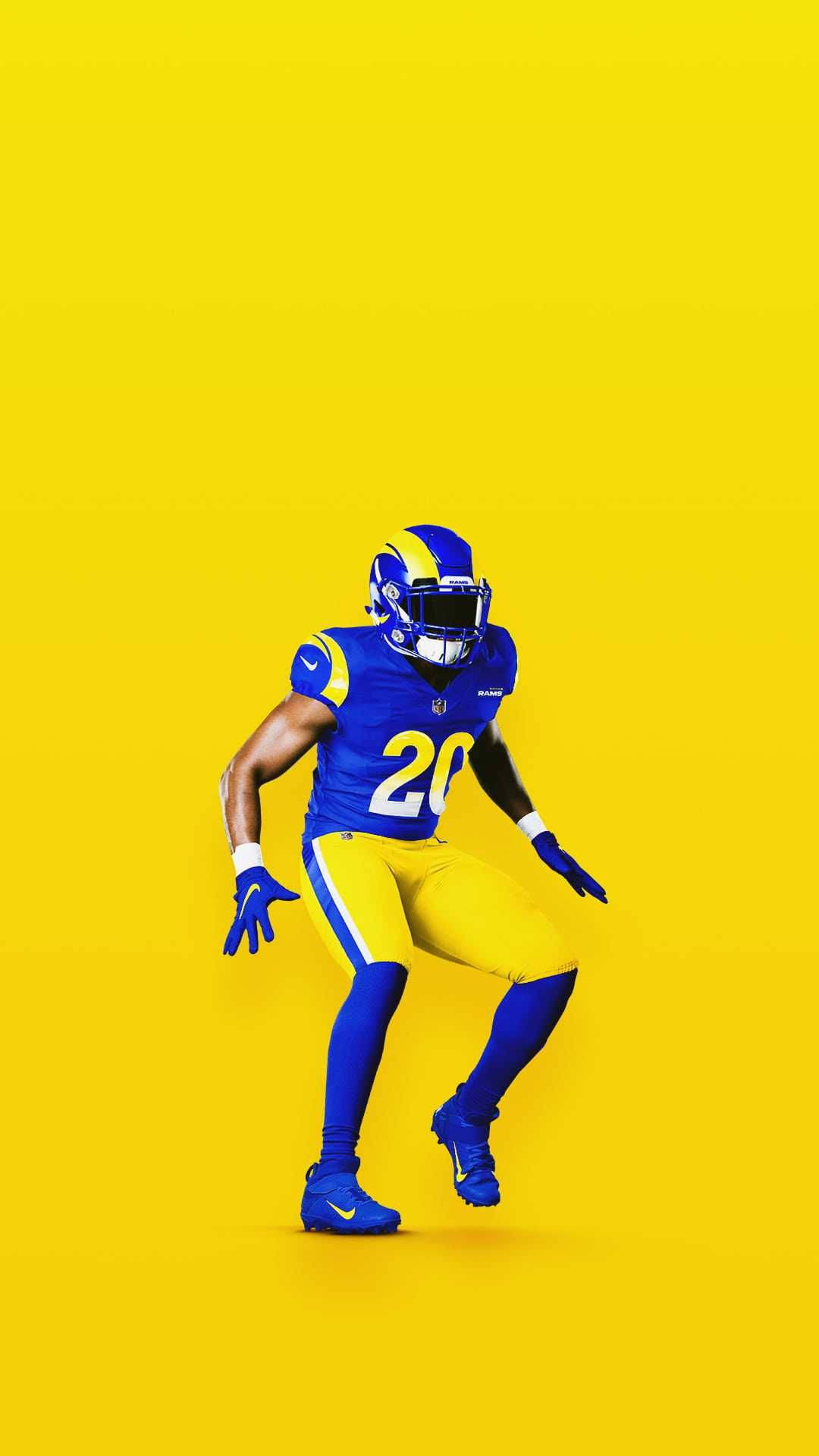 Ramsey 桌布 壁紙 — 一名身穿藍黃色球衣的足球運動員在純黃色背景上動態擺姿勢。