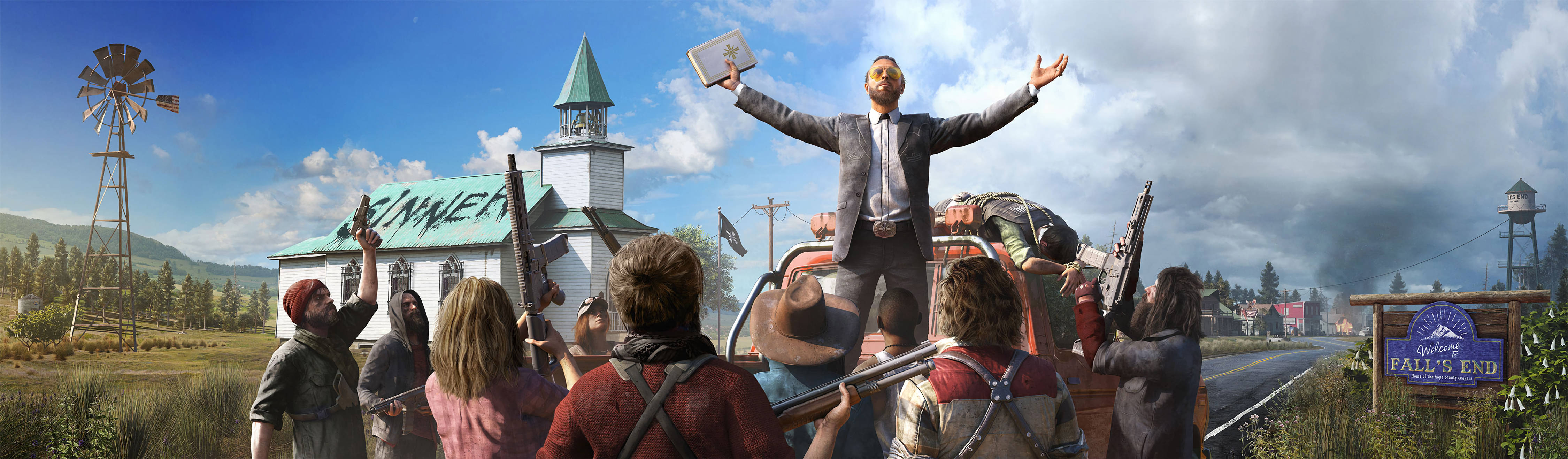 Far Cry 5 桌布 壁紙 — 一名身穿西裝的男子在鄉村小鎮的卡車上得意地站立，雙臂高舉，武裝追隨者聚集在他周圍，天空多雲。