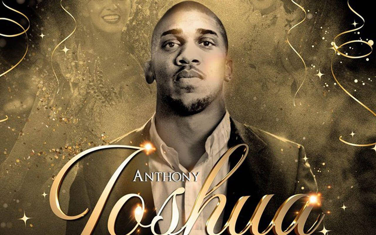 Anthony Joshua 桌布 壁紙 — 一名身穿西裝的男子在金色閃爍的背景上，配以旋轉絲帶和閃爍星星，凝視前方。