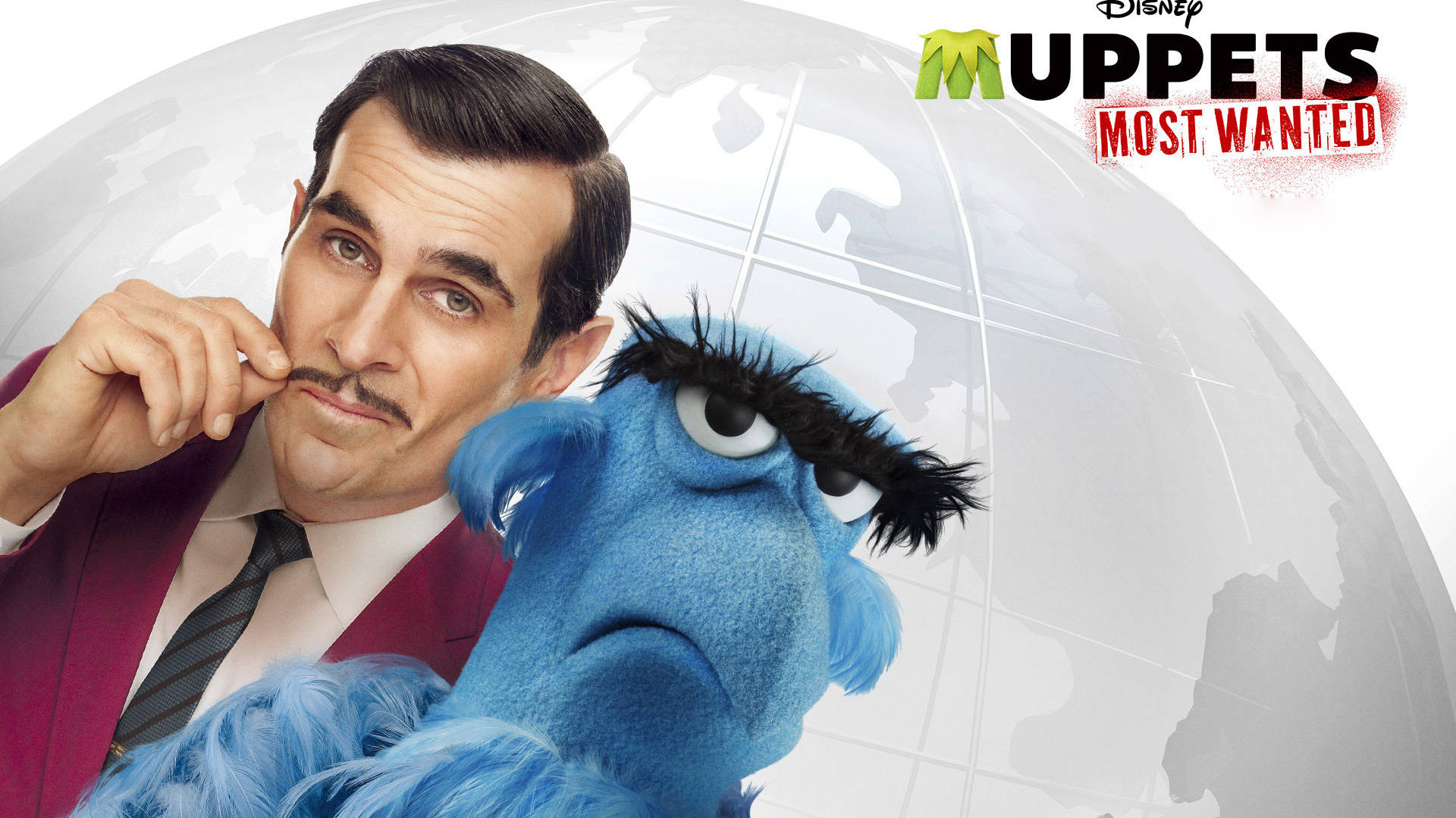 muppets 桌布 壁紙 — 一名身穿酒紅色西裝的男子和一個有濃密黑色眉毛的藍色毛絨木偶，在一個半透明的地球背景前擺姿勢。