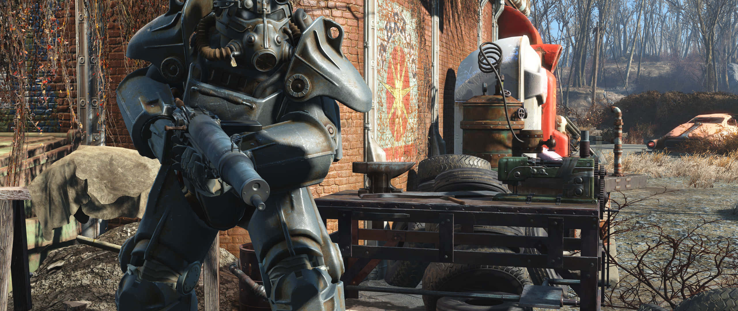 Fallout Nv 桌布 壁紙 — 一名身穿重型動力裝甲的士兵在一個破舊的末日後工場中站崗，工場裡滿是廢金屬和生鏽的車輛。