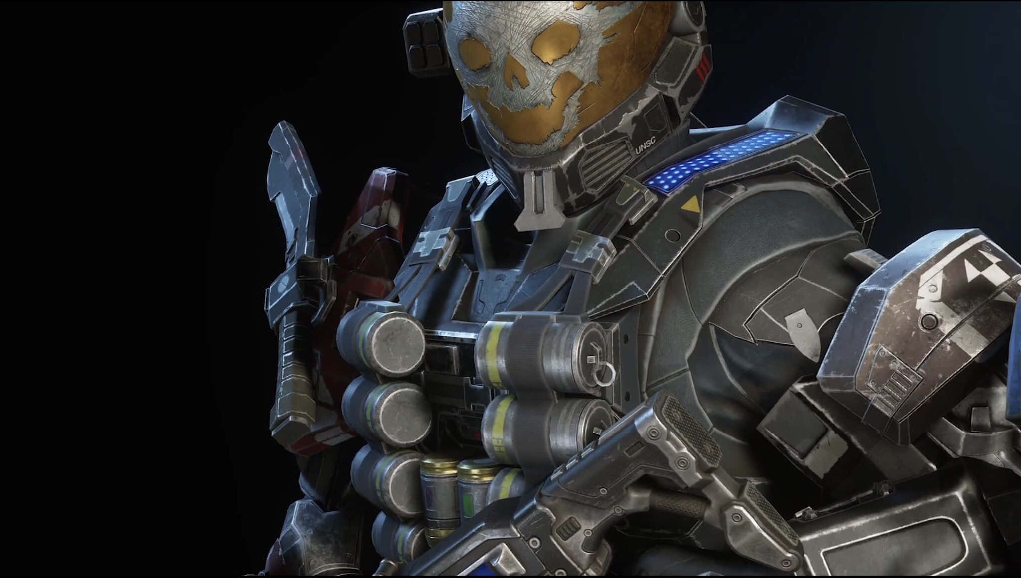 Halo Emile 桌布 壁紙 — 一名身穿重甲、戴著骷髏頭盔並帶有發光藍色裝飾的士兵，站在黑暗背景前。