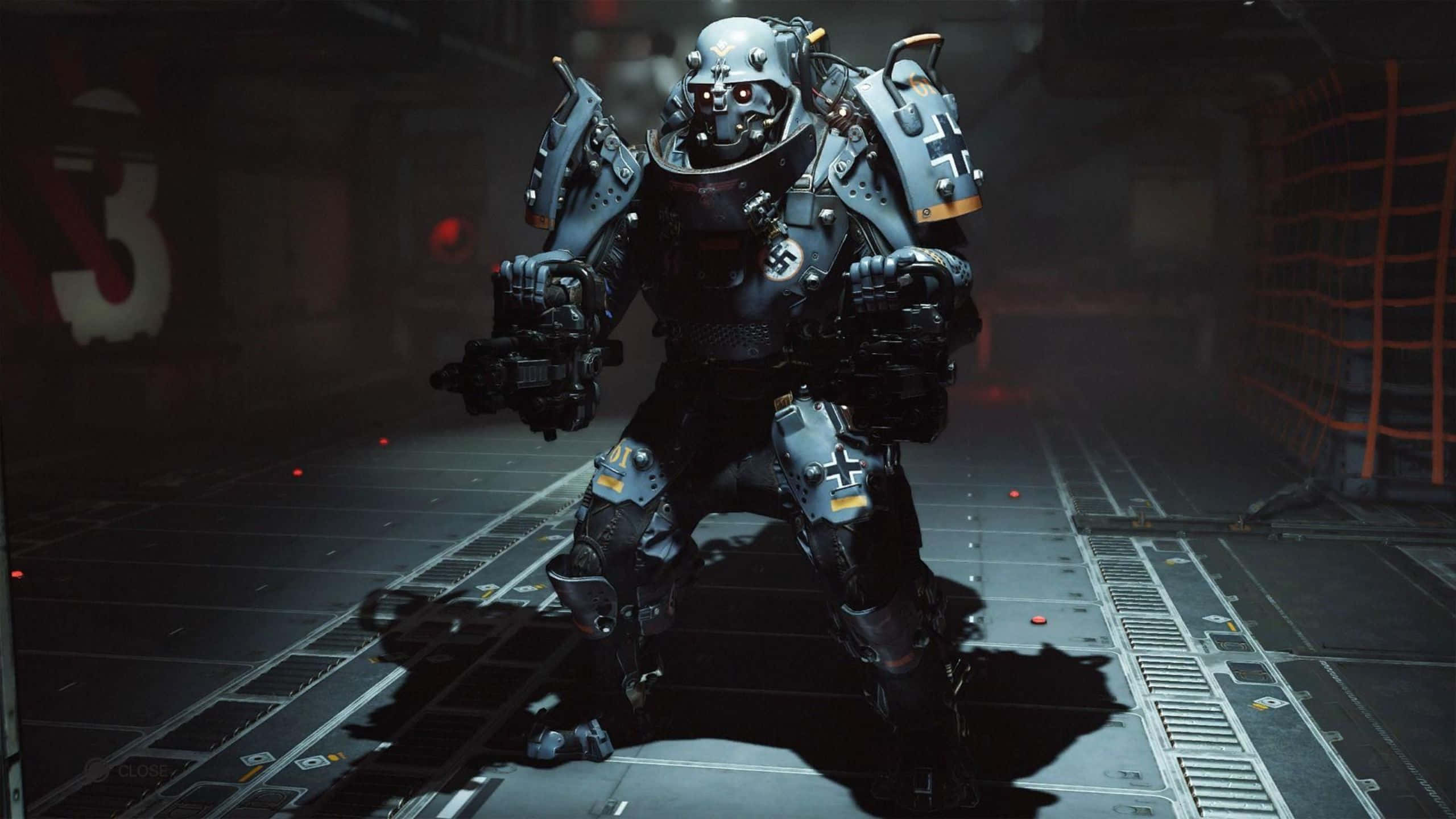 Wolfenstein Ii 桌布 壁紙 — 一名身穿重裝甲的未來戰士站在昏暗的工業走廊中，周圍有發光的紅燈和金屬地板。