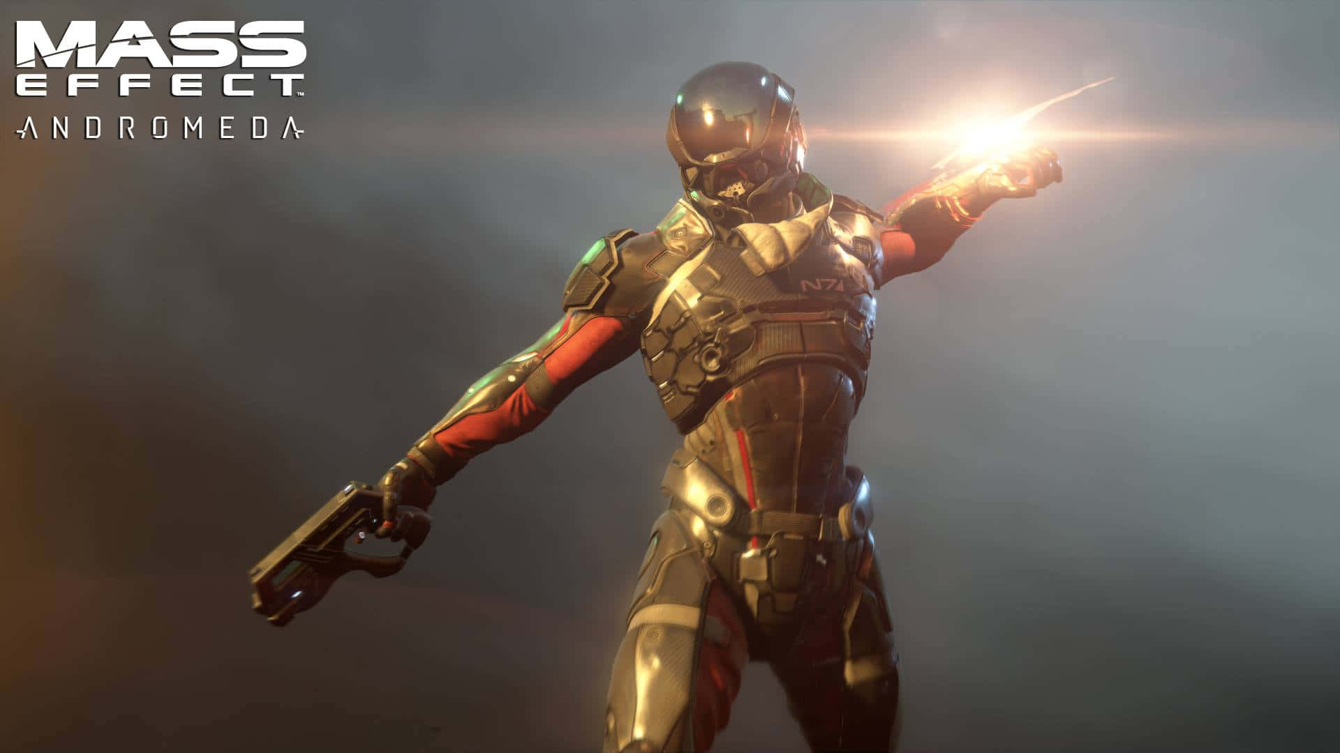 Mass Effect Andromeda 桌布 壁紙 — 一名身穿金屬盔甲的未來士兵在模糊的背景中發射發光武器，遊戲標題可見。