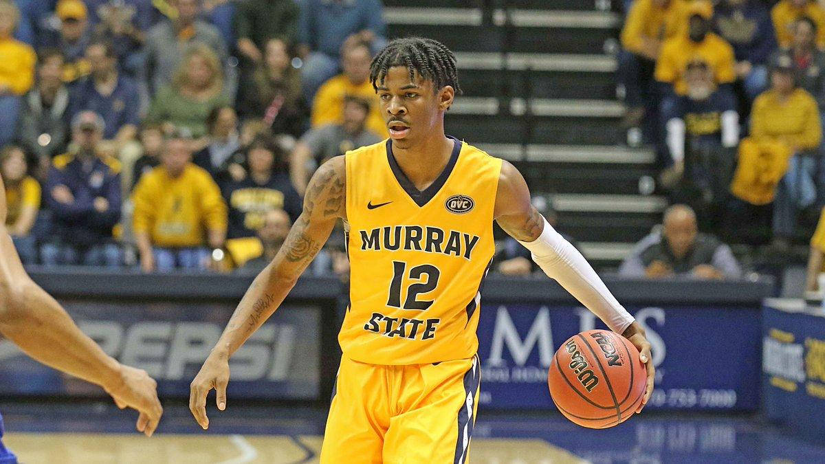 身穿黃色球衣的籃球運動員在比賽中運球，背後有群眾。 — Ja Morant 動圖 壁紙