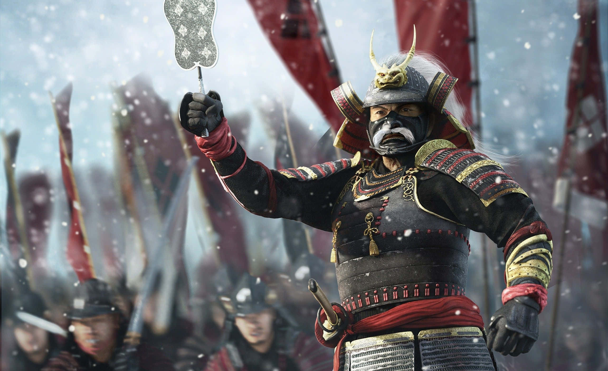 Shogun 桌布 壁紙 — 一名身著華麗盔甲的武士戰士在雪地戰場上舉起雪花形狀的扇子，背景有紅色旗幟。