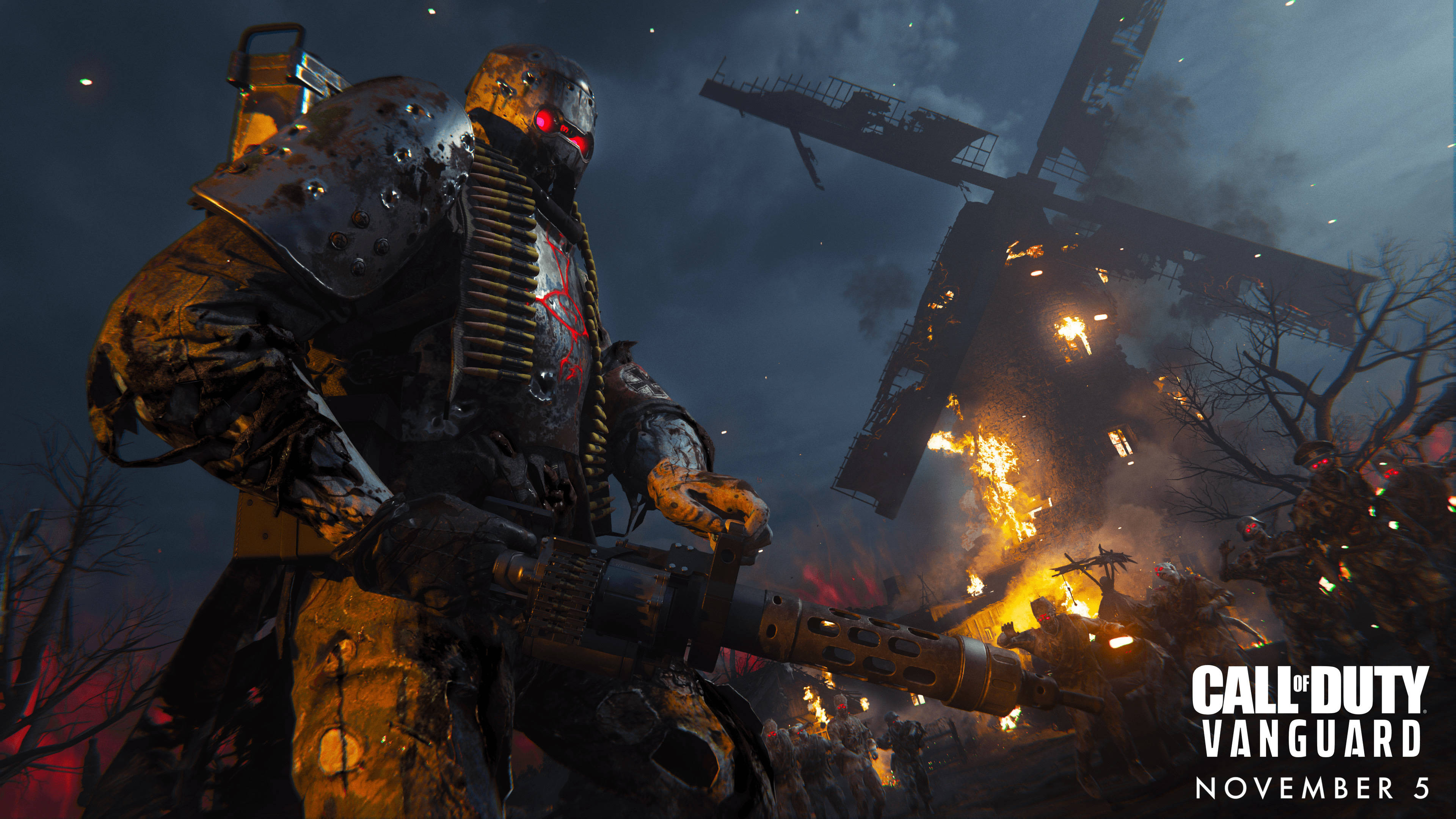Call Of Duty Vanguard 桌布 壁紙 — 一名重裝士兵，雙眼發出紅光，在夜晚燃燒的風車中揮舞著機槍。