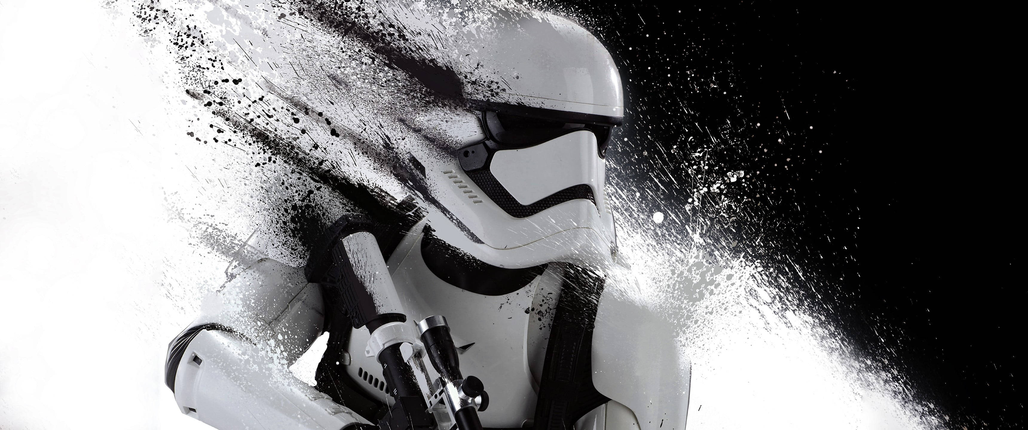 Stormtrooper 桌布 壁紙 — 一名風暴兵從動態的白色和黑色粒子爆炸中出現，背景是純黑色。