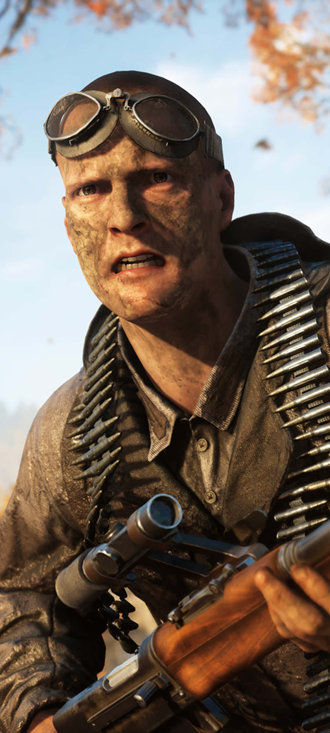 Pixel 3xl Battlefield V 桌布 壁紙 — 一名骯髒的士兵戴著護目鏡和彈藥帶，在秋葉和晴朗天空的背景下凝視著。
