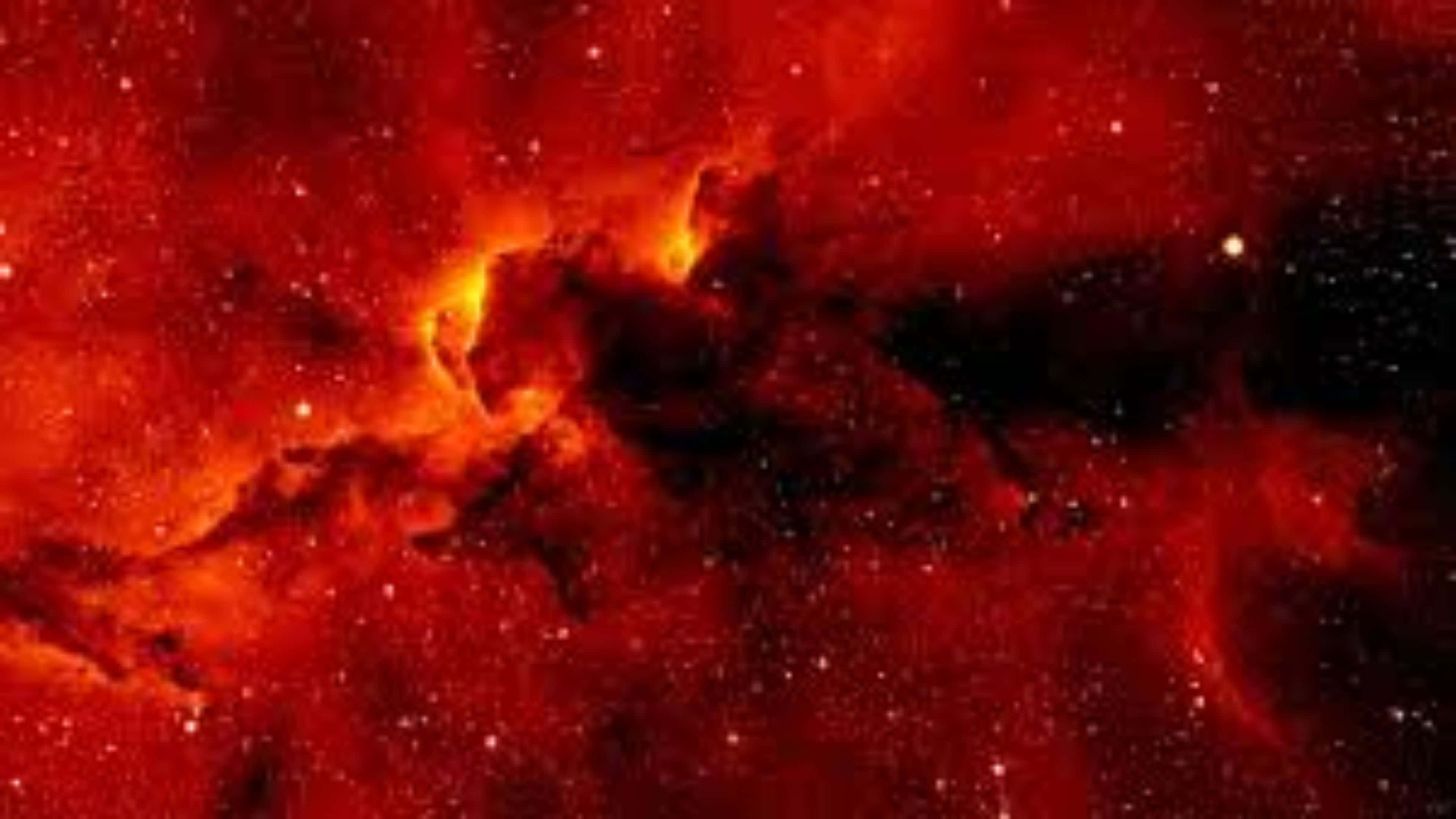 Red Space 桌布 壁紙 — 一團火紅色的星雲在黑暗的宇宙虛空中旋轉，帶有發光的橙色核心和散落的星星。