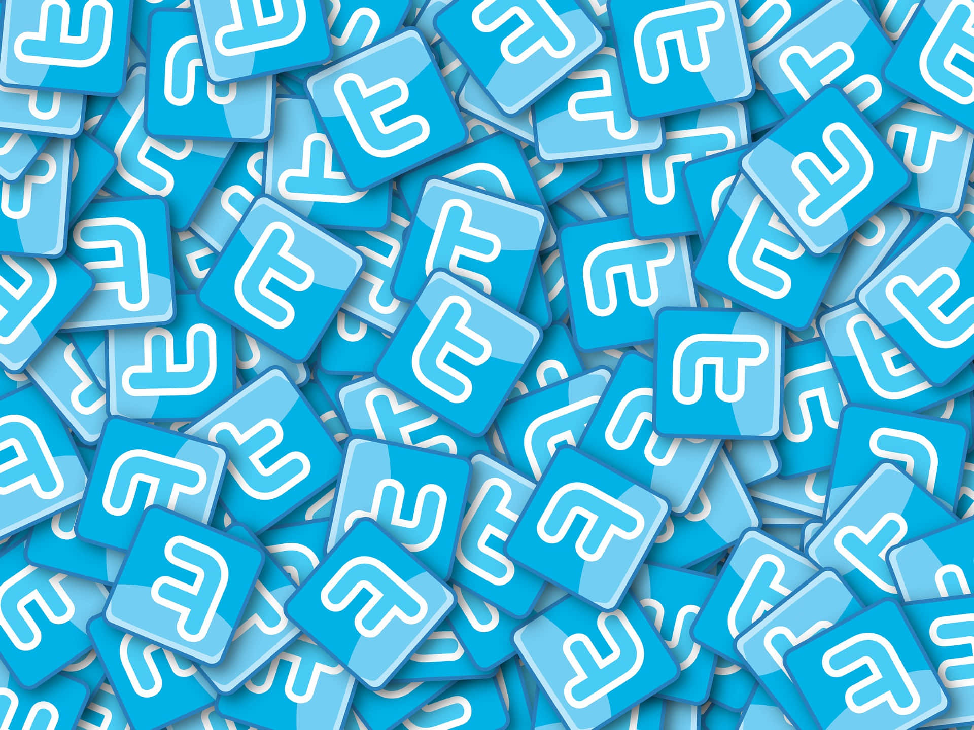 Twitter 桌布 壁紙 — 一堆密集的光澤藍色方形瓷磚，每個都帶有白色風格化的「F」標誌。