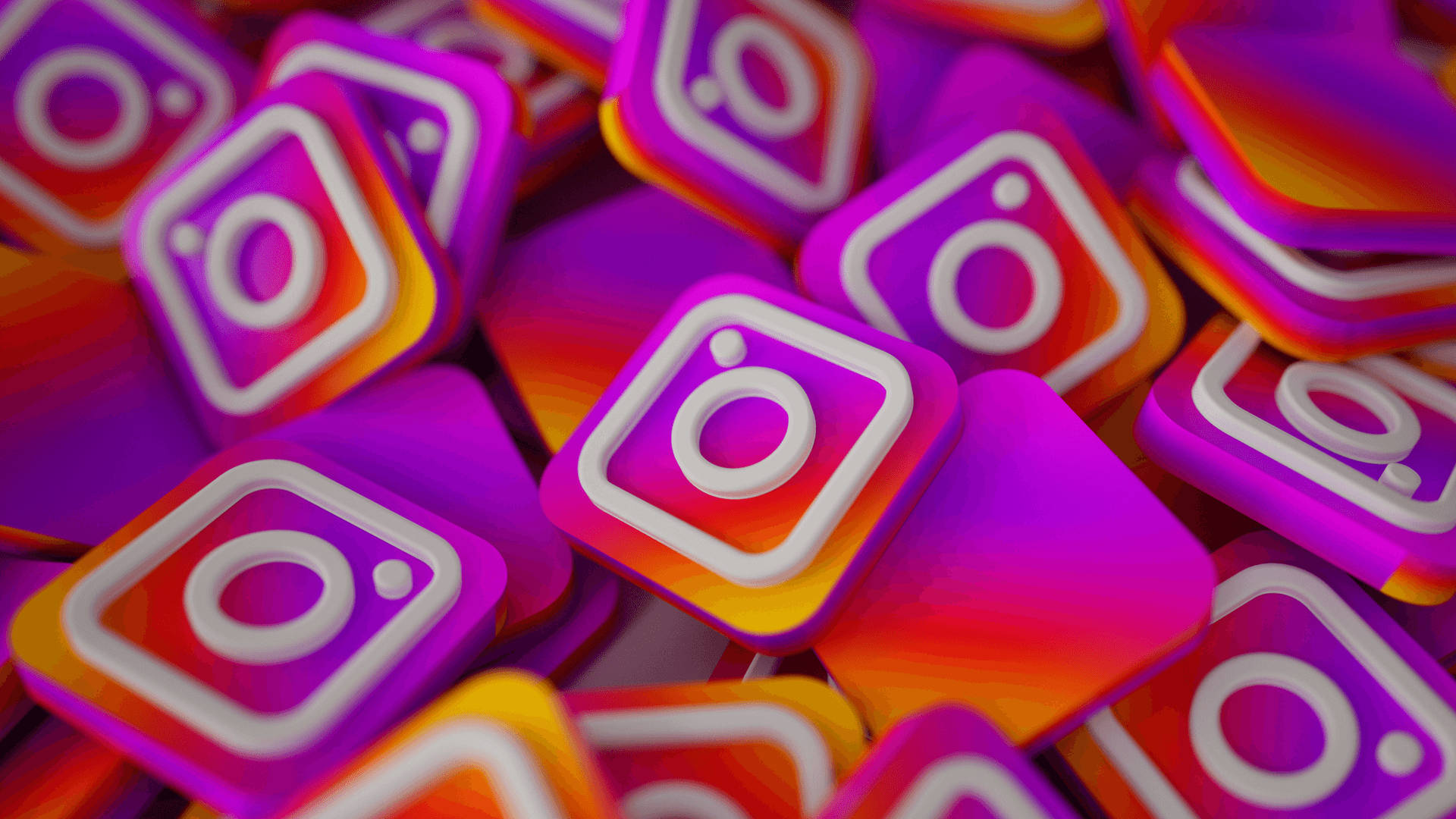 Instagram 桌布 壁紙 — 一堆色彩鮮豔的 3D 渲染 Instagram 應用程式圖示，帶有紫色、橙色和白色的漸變色。