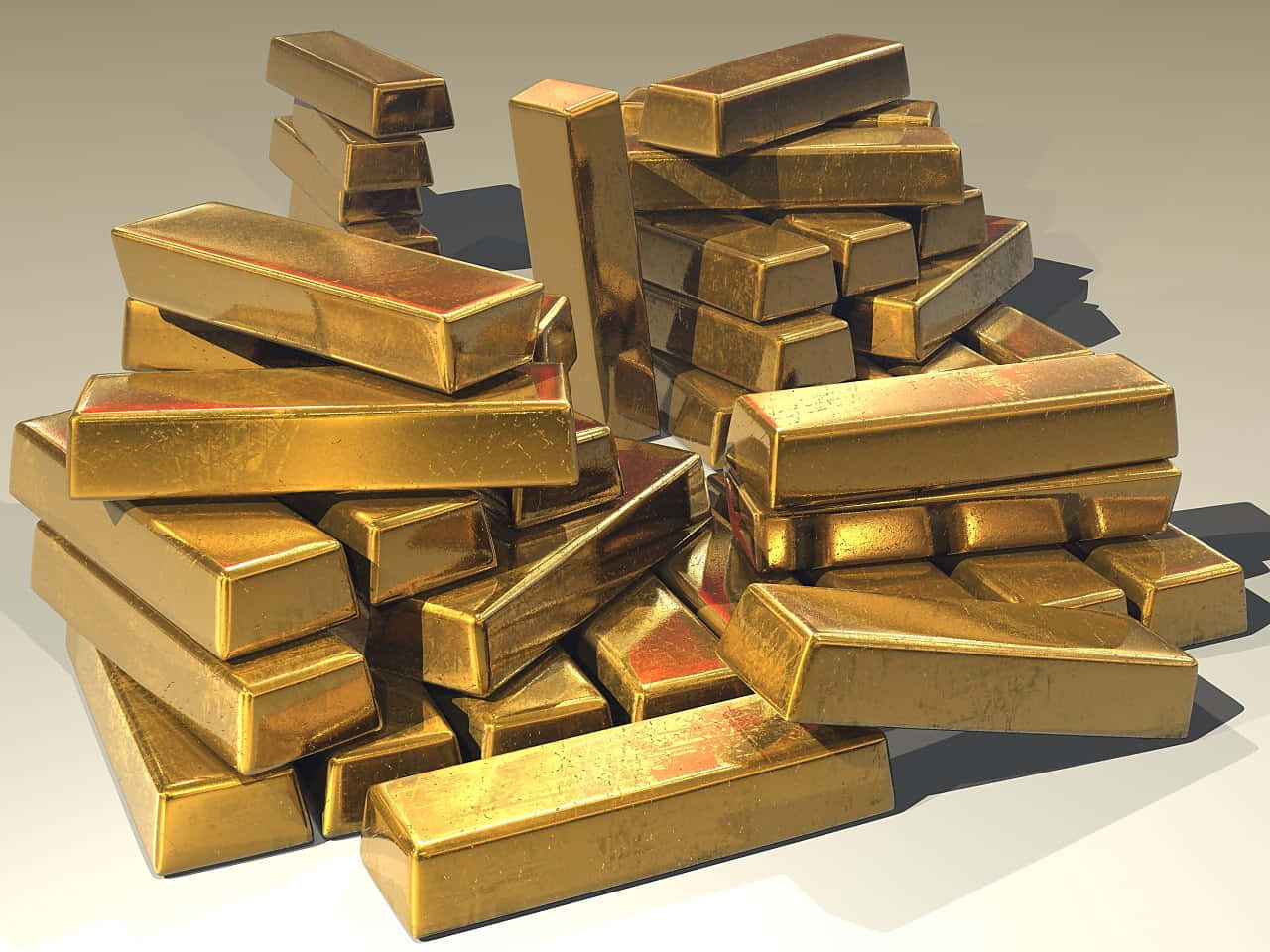 Gold Bars 桌布 壁紙 — 一堆閃閃發光的金條隨意堆放在中性表面上，帶有銳利的陰影和反射表面。