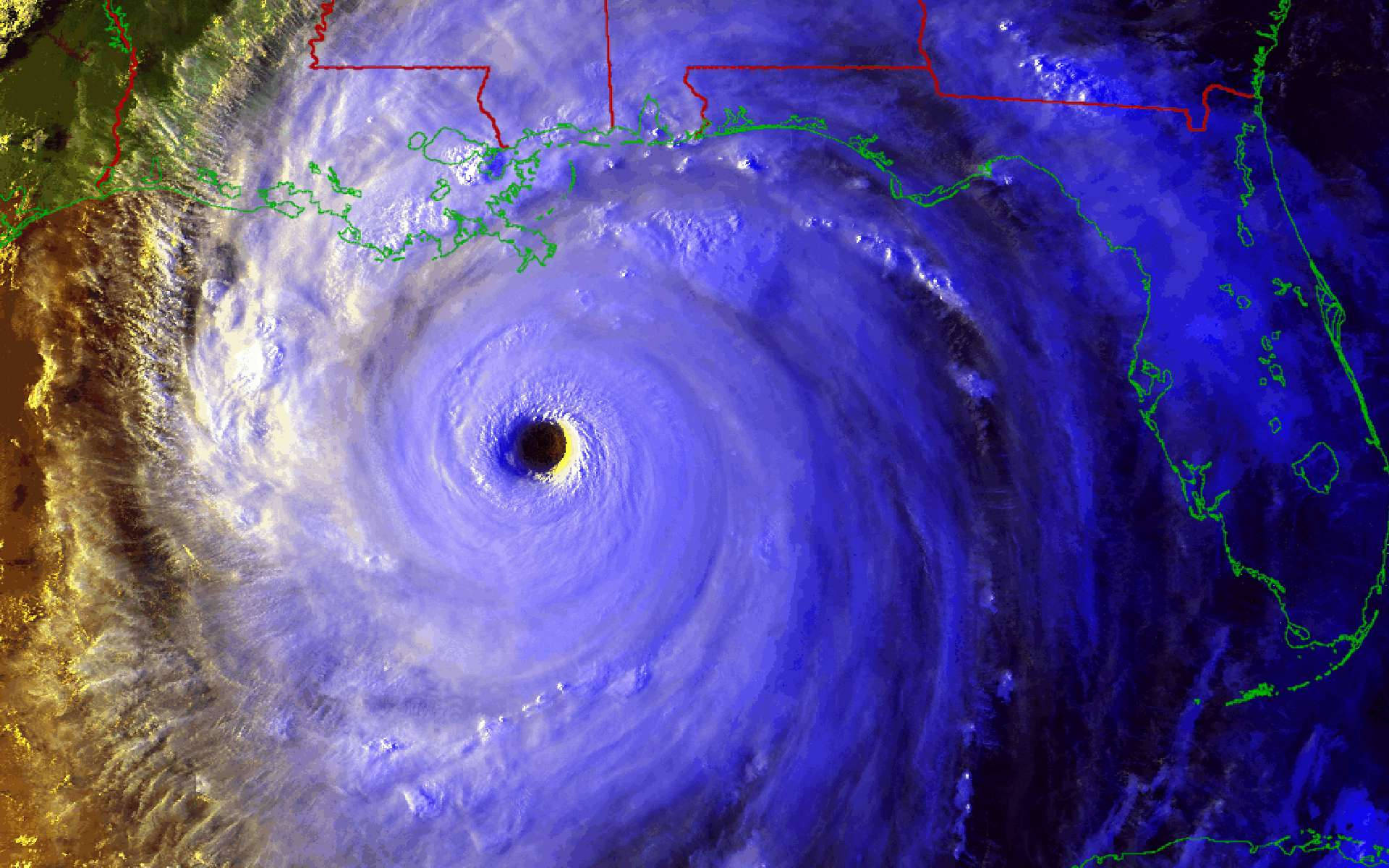 Hurricane 桌布 壁紙 — 一場帶有黑暗風眼的巨大颶風在墨西哥灣沿岸旋轉，伴隨著旋轉的藍色和白色雲層。