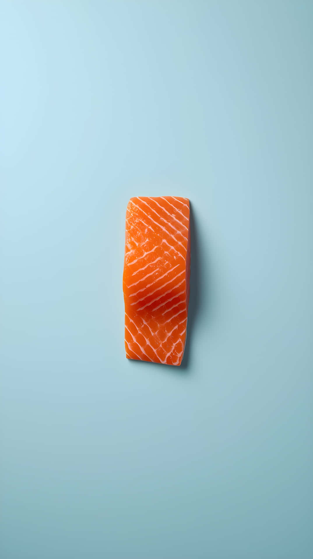 Simple Aesthetic Salmon Food Photography Background 壁紙 — 一塊生鮭魚片，帶有明顯的橙色肉質和白色大理石紋，居中放置在純淺藍色背景上。