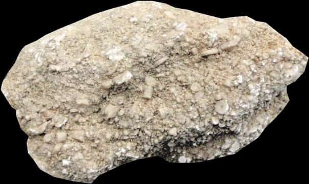 The Rock 桌布 壁紙 — 一塊粗糙紋理的米色岩石，帶有白色礦物沉積物，孤立地矗立在純黑背景前。
